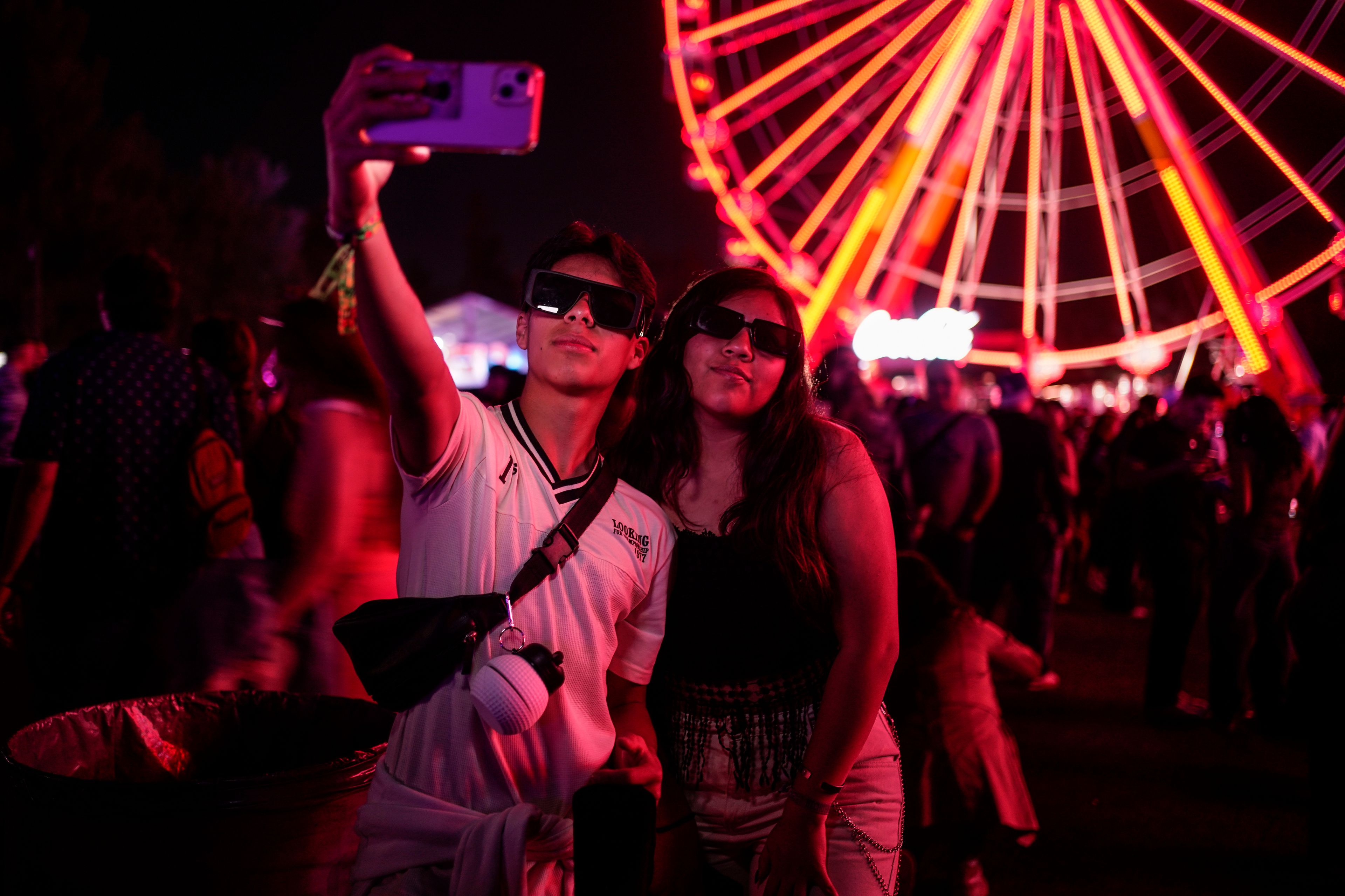 Fans take a selfie during the Coca-Cola Flow Fest music festival in Mexico City, Nov. 23, 2024. (AP Photo/Felix Marquez)