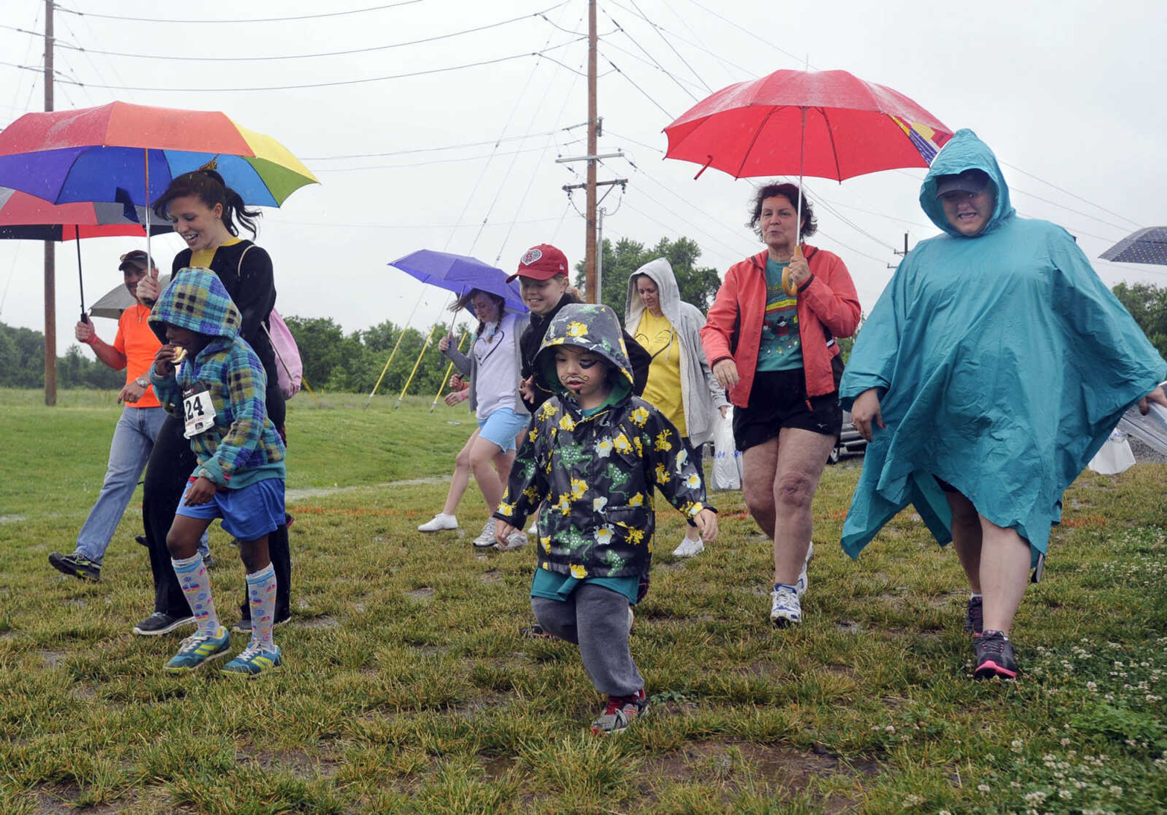 FRED LYNCH ~ flynch@semissourian.com
Walkers begin a 1-mile family wellness walk at the Jacque Waller 5K event Saturday, June 1, 2013 at Shawnee Park in Cape Girardeau.