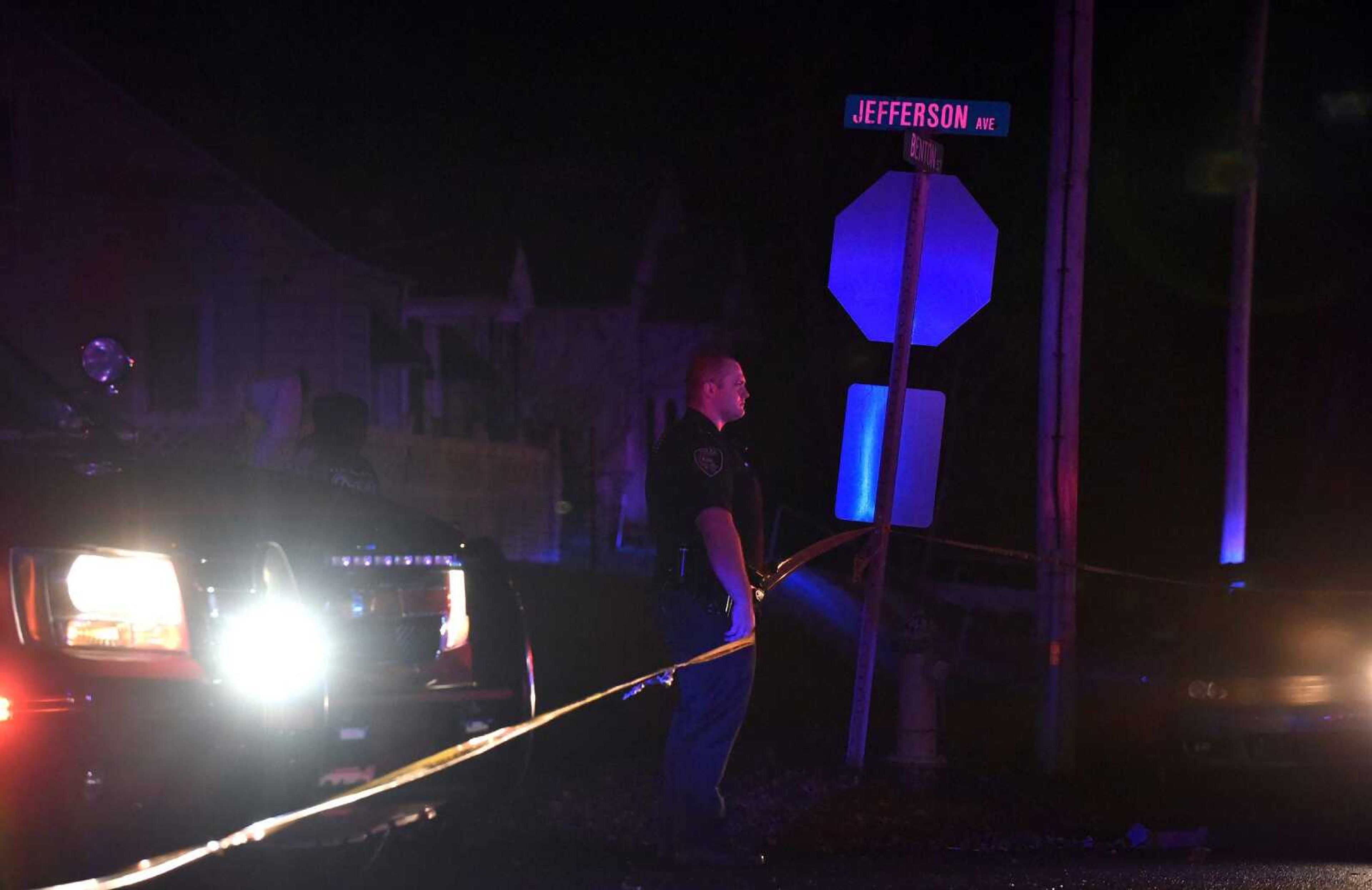 An officer with the Cape Girardeau Police Department stands watch at the corner of South Benton Street and Jefferson Avenue after a shooting near the intersection Wednesday evening.