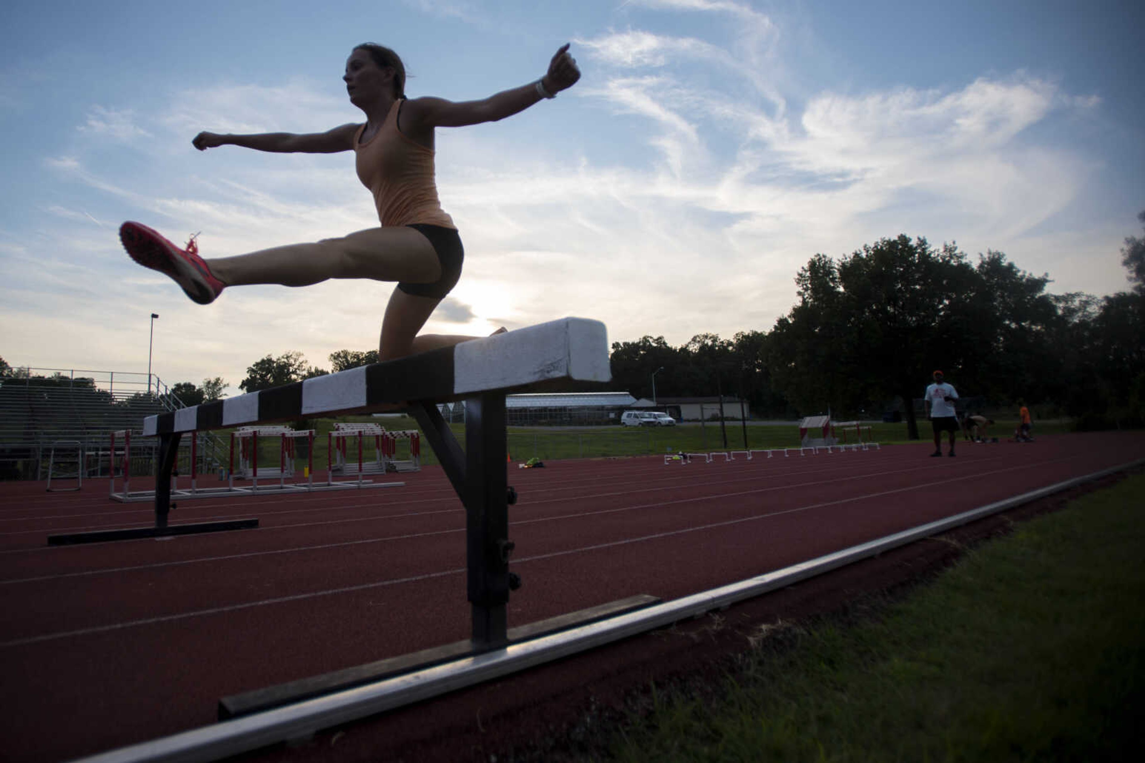 Margo Nea leaps over a barrier during practice Thursday, July 25, 2019, at the Abe Stuber Track & Field Complex in Cape Girardeau.