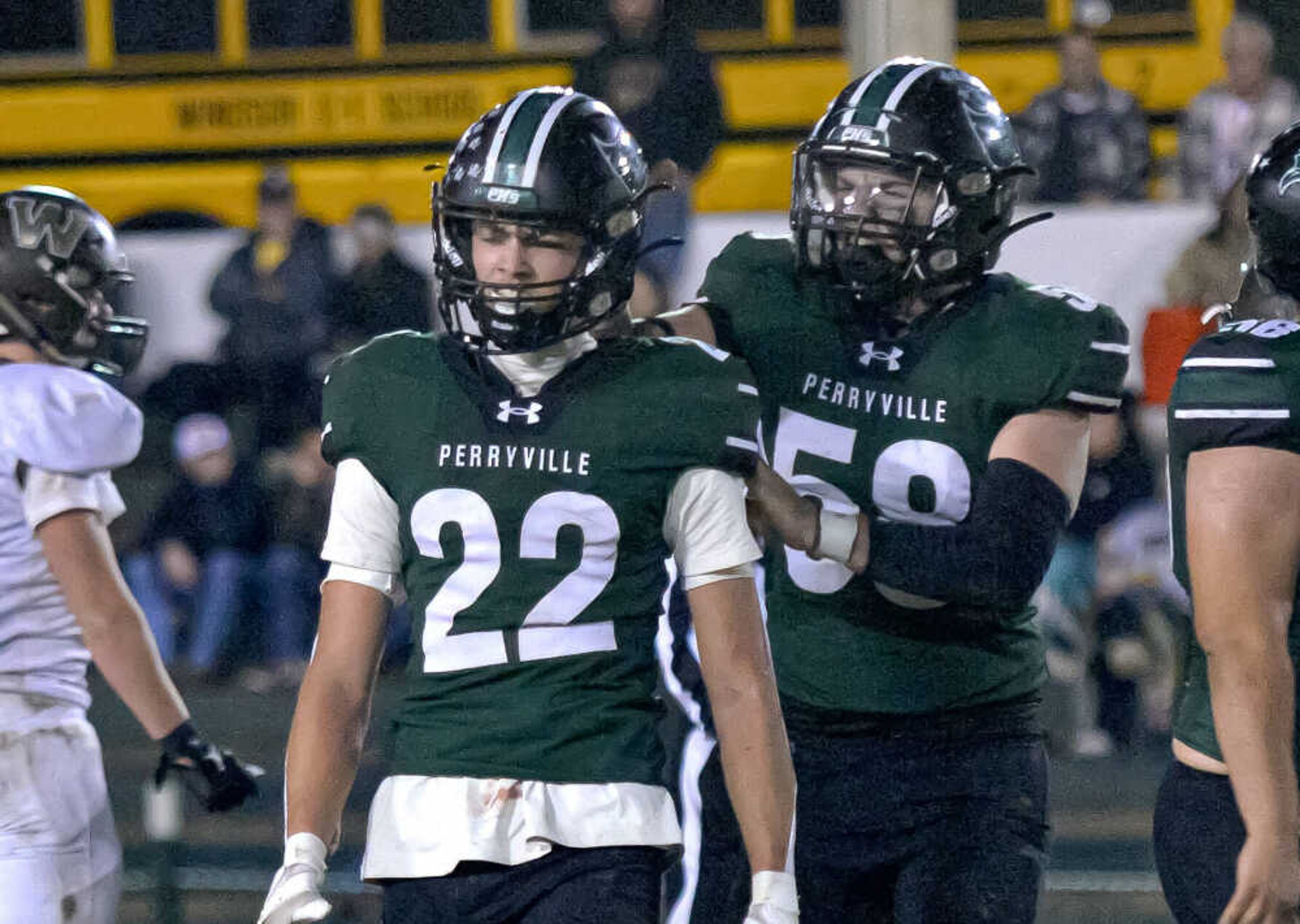 Perryville linebacker Korbin Rollett, right, celebrates Evan Hayden making a stop against Windsor in the Class 4 District 1 playoffs Friday, Nov. 1, in Perryville.