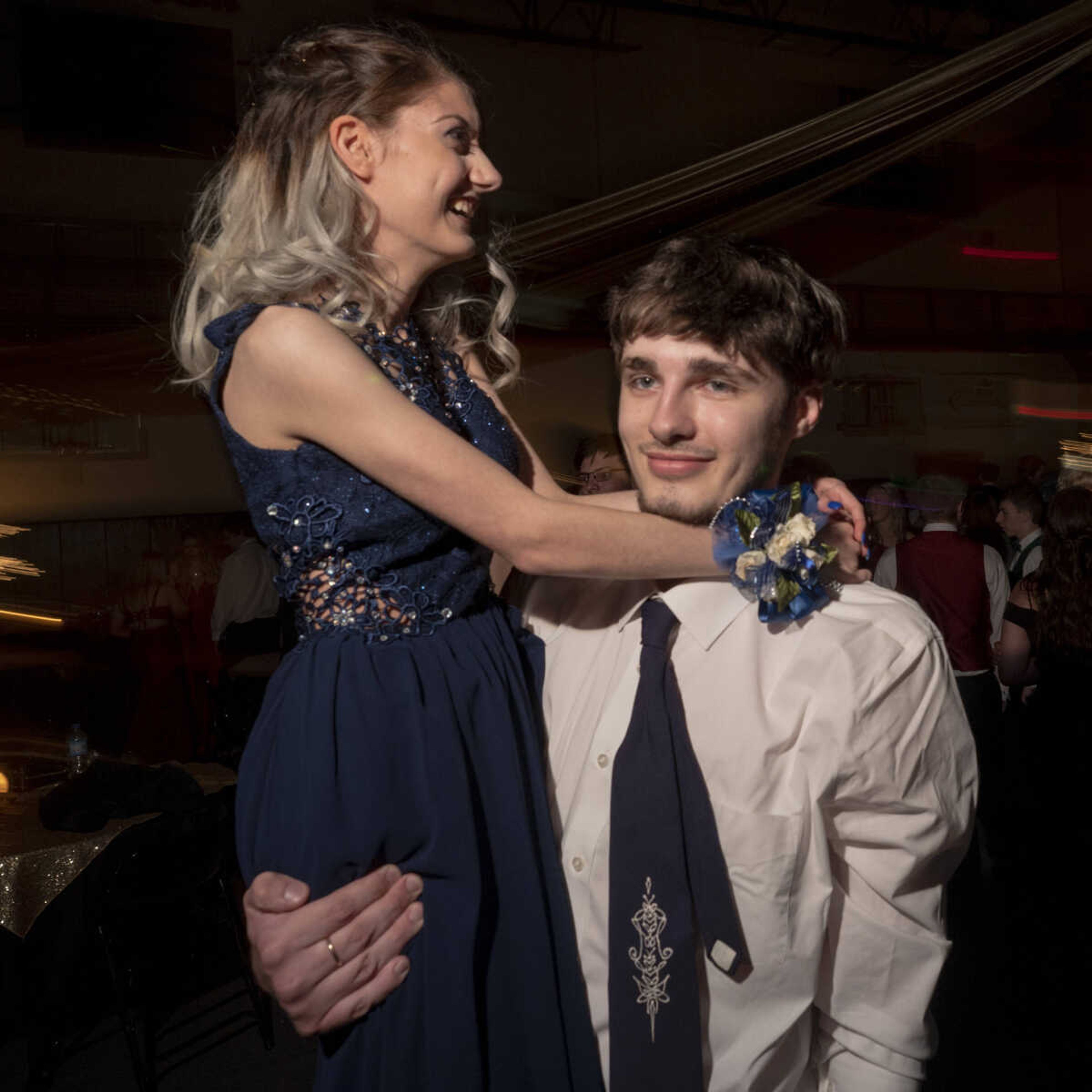 Anthony Long lifts up Felicia Bierschwal on the dance floor during prom Saturday, May 1, 2021 at Jackson High School.