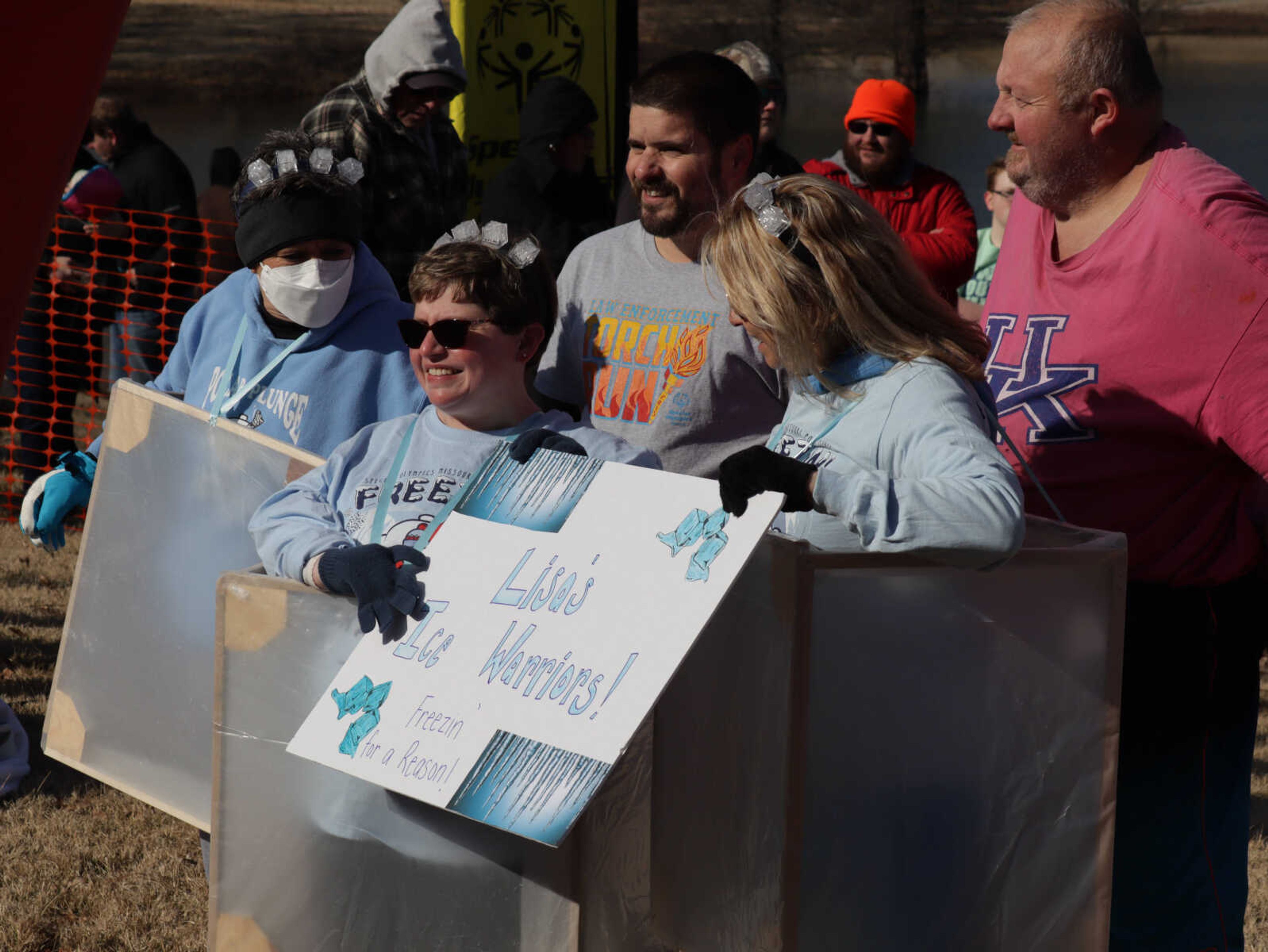 One of the plunging teams Lisa's Ice Warriors smiling for the camera before they jump in.