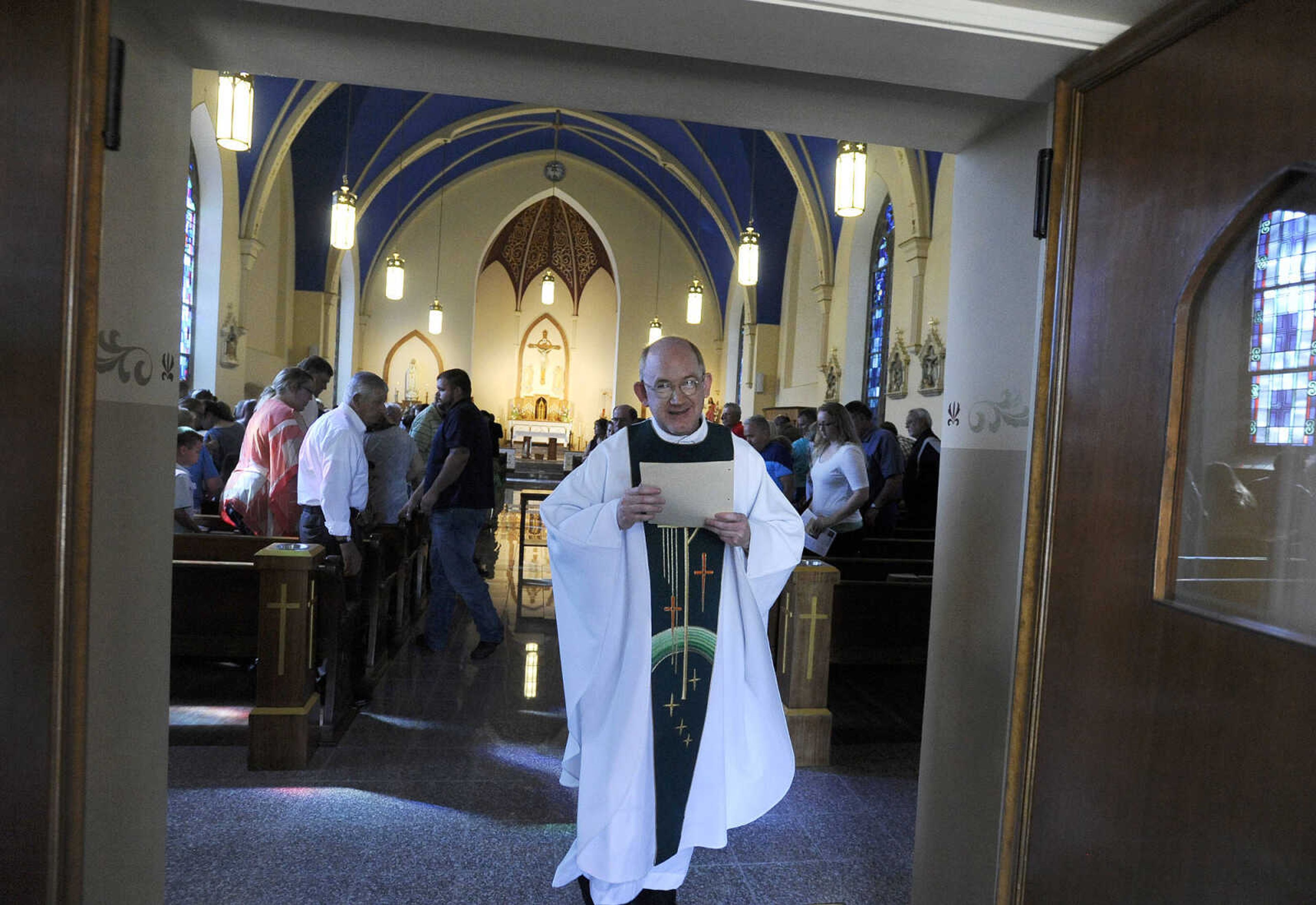 LAURA SIMON ~ lsimon@semissourian.com

The Rev. David Coon exits the newly remodeled St. John's Catholic Church in Leopold, Missouri after celebrating the first parish mass since the remodel on Sunday, May 29, 2016.