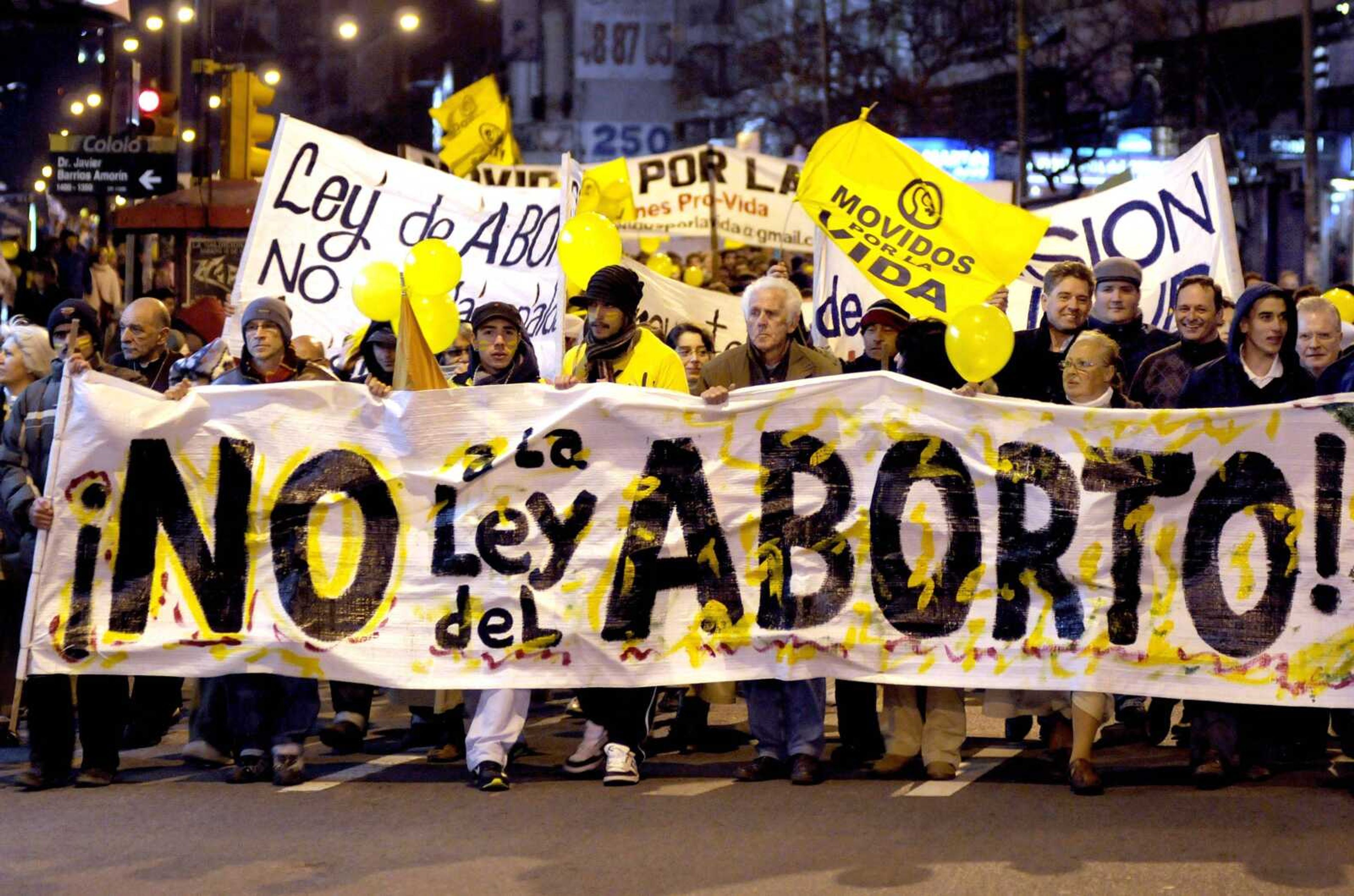 People demonstrate against abortion legalization Monday in downtown Montevideo, Uruguay. (Matilde Campodonico ~ Associated Press)