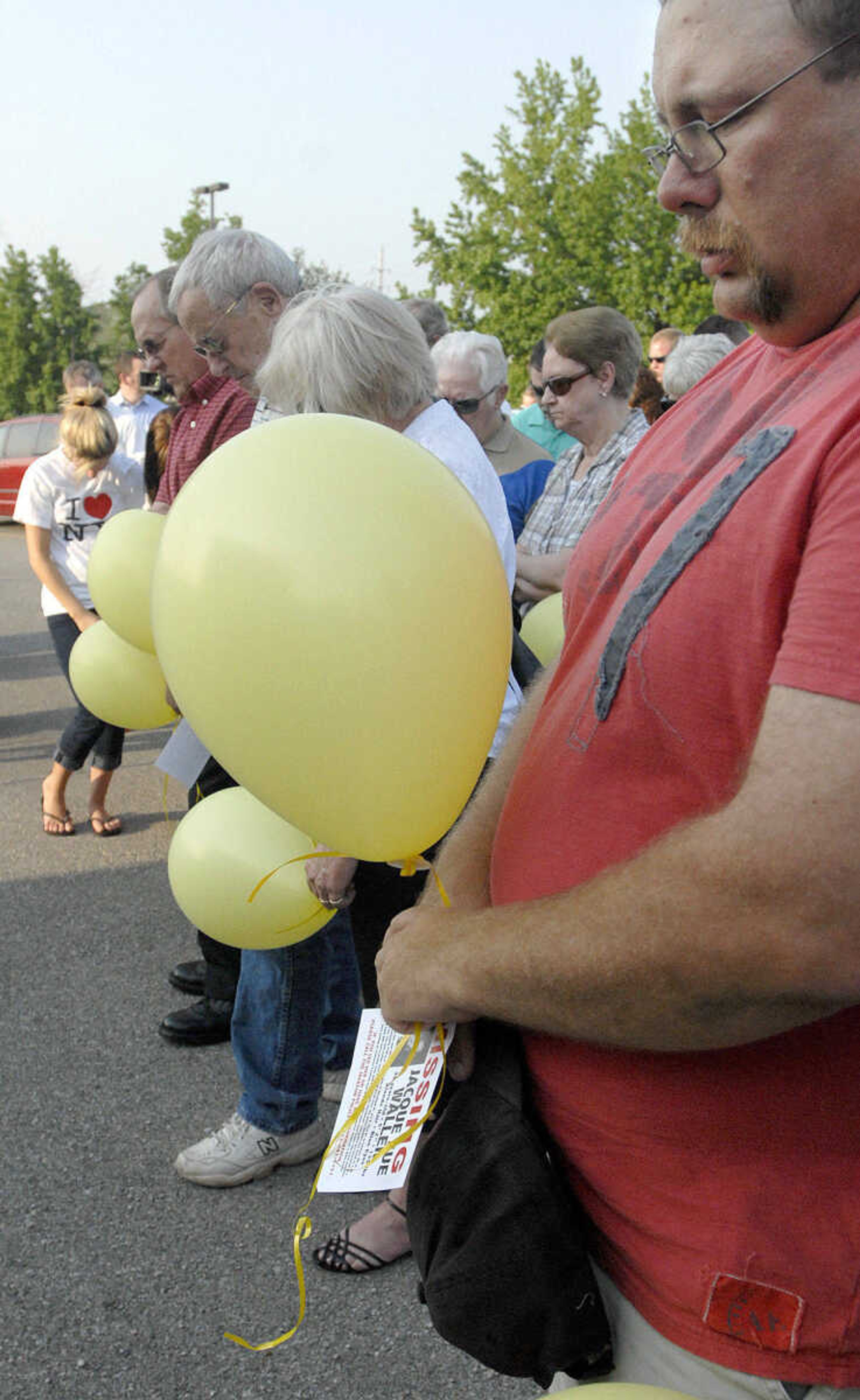 LAURA SIMON~lsimon@semissourian.com
Friends and family of Jacque Sue Waller bow their heads in prayer Thursday, June 9, 2011 during a prayer service for Waller at Farmington High School. Waller, a 39-year-old mother of three, has been missing since June 1, 2011.