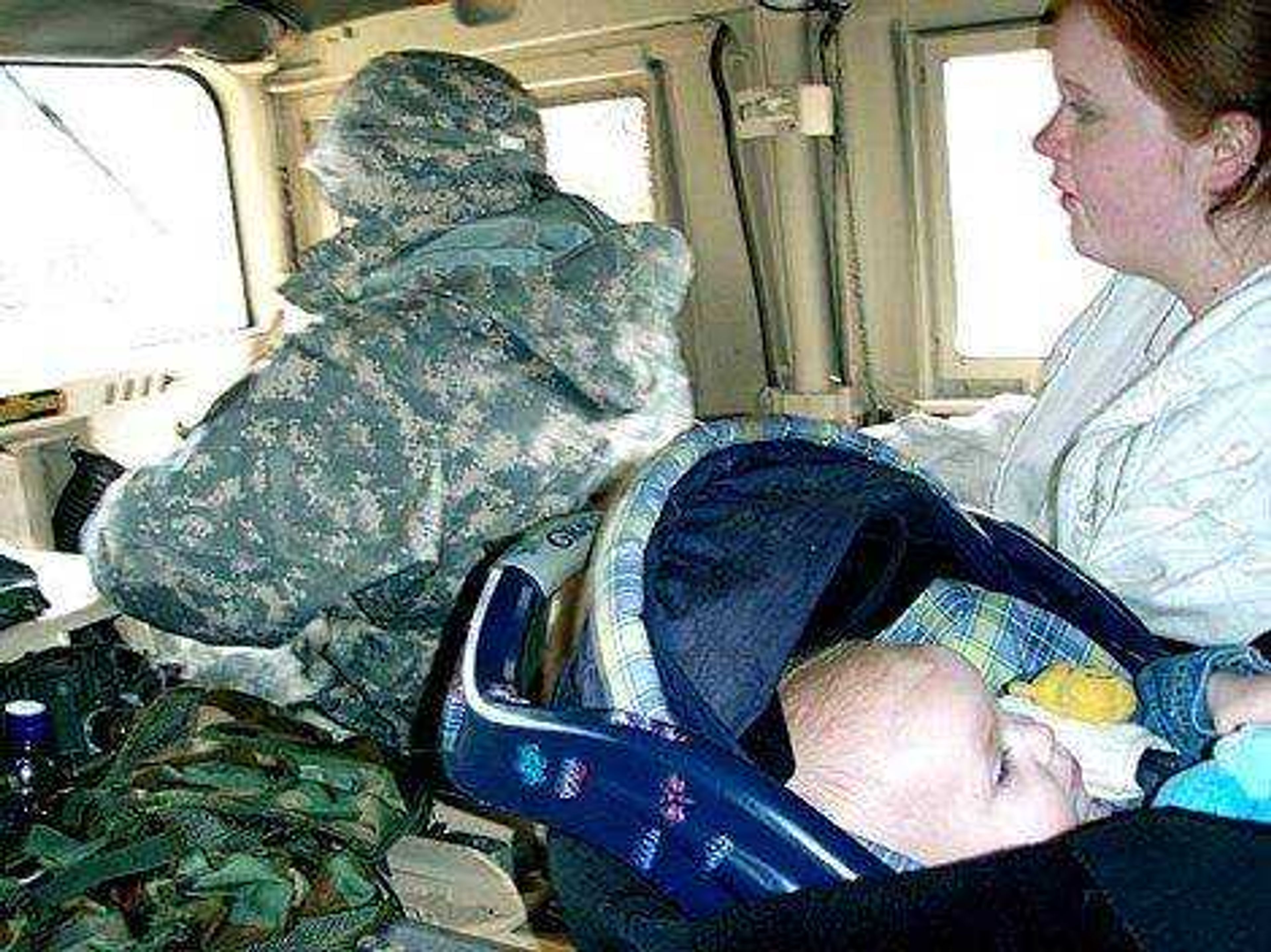 John Quin ~ Submitted photo
Spc. Terrell McCollough of the Missouri Army National Guard held infant Lillian Poneer. The infant and her mother had been stranded for an hour and a half after their car broke down outside Piedmont.