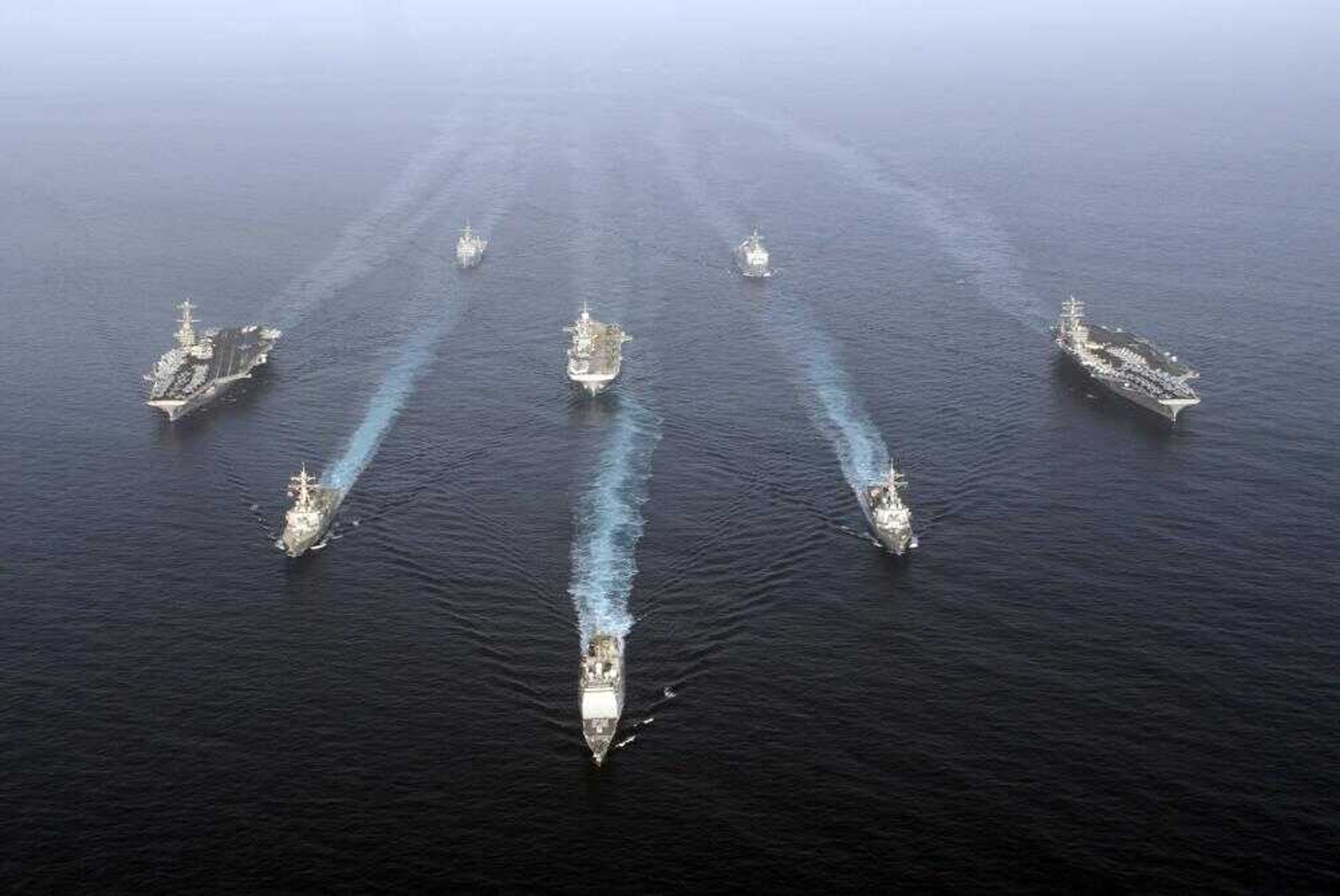 The USS John C. Stennis, USS Nimitz and USS Bonhomme Richard strike groups steamed through the Gulf of Oman on Tuesday. The U.S. Navy staged its latest show of military force off the Iranian coastline sending the three strike groups through the narrow Strait of Hormuz on Wednesday. (Denny Cantrell ~ U.S. Navy)