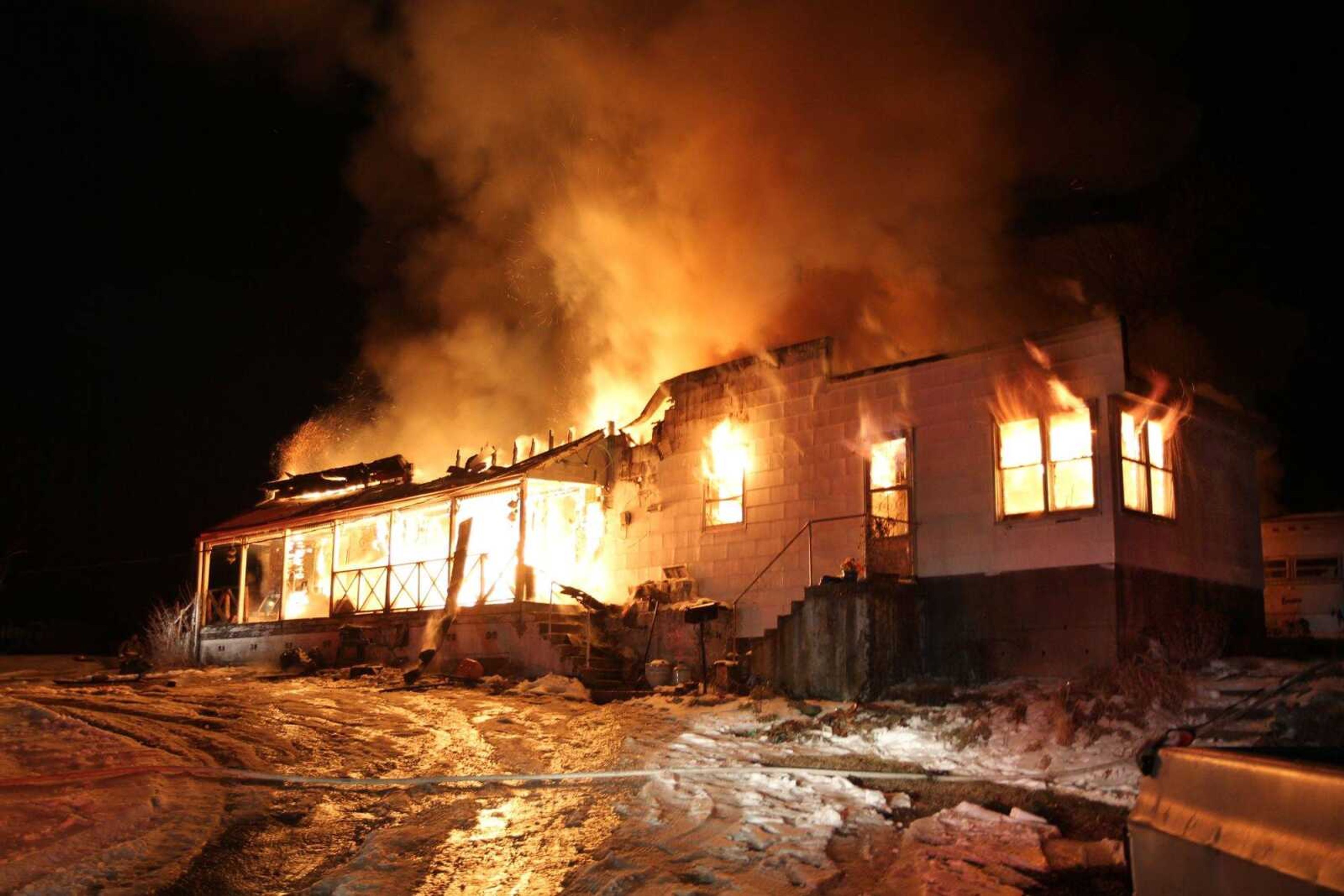 Members from the Fruitland and Jackson fire departments battle a blaze that broke out in a home at 649 Jackson Road in Pocahontas on Friday night. (Glenn Landberg)