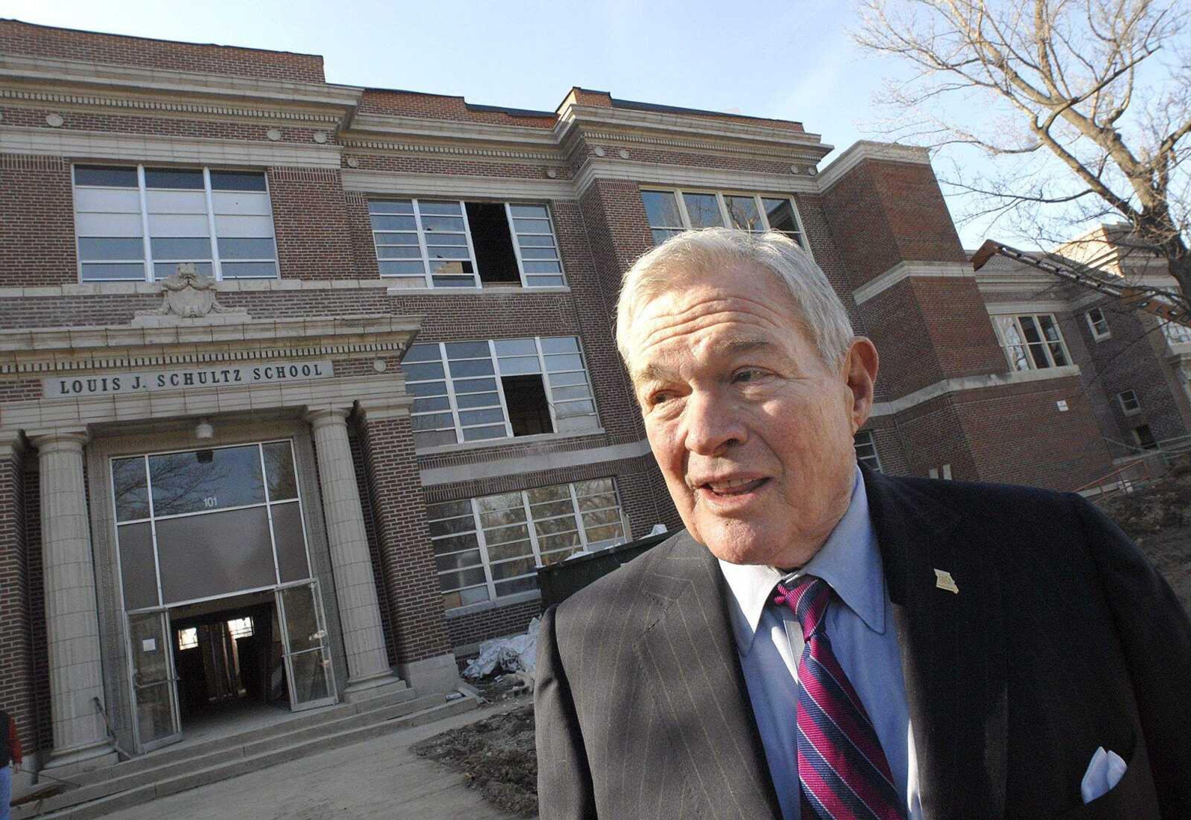 FRED LYNCH ~ flynch@semissourian.com
Senator Kit Bond discusses the president's stimulus package Monday outside the old Louis J. Schultz School in Cape Girardeau. He toured the building which is being renovated for senior apartments.