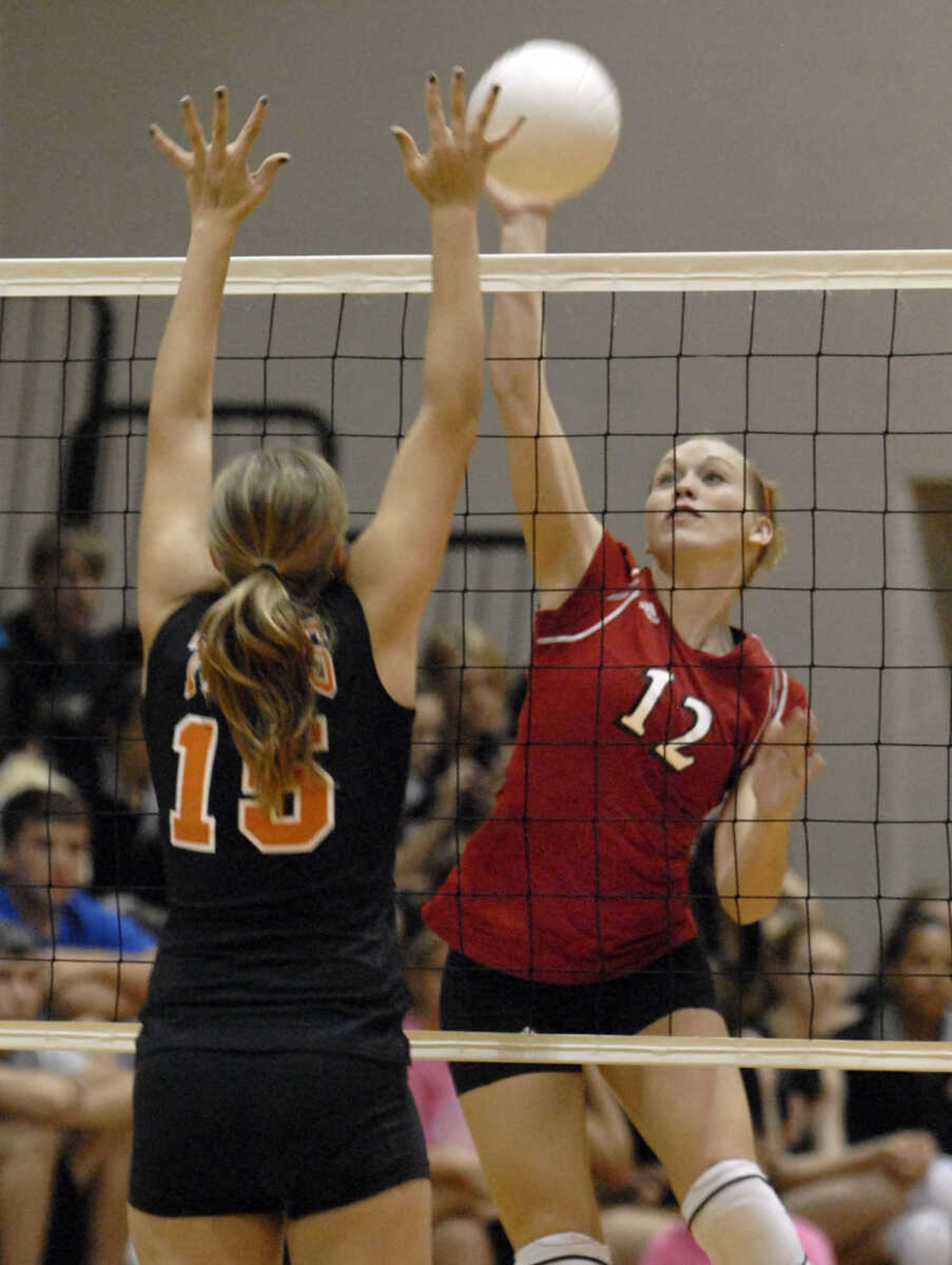 FRED LYNCH ~ flynch@semissourian.com
Jackson's Taylor Glueck spikes over Central's Tori Scheller in the second game Wednesday at Central.