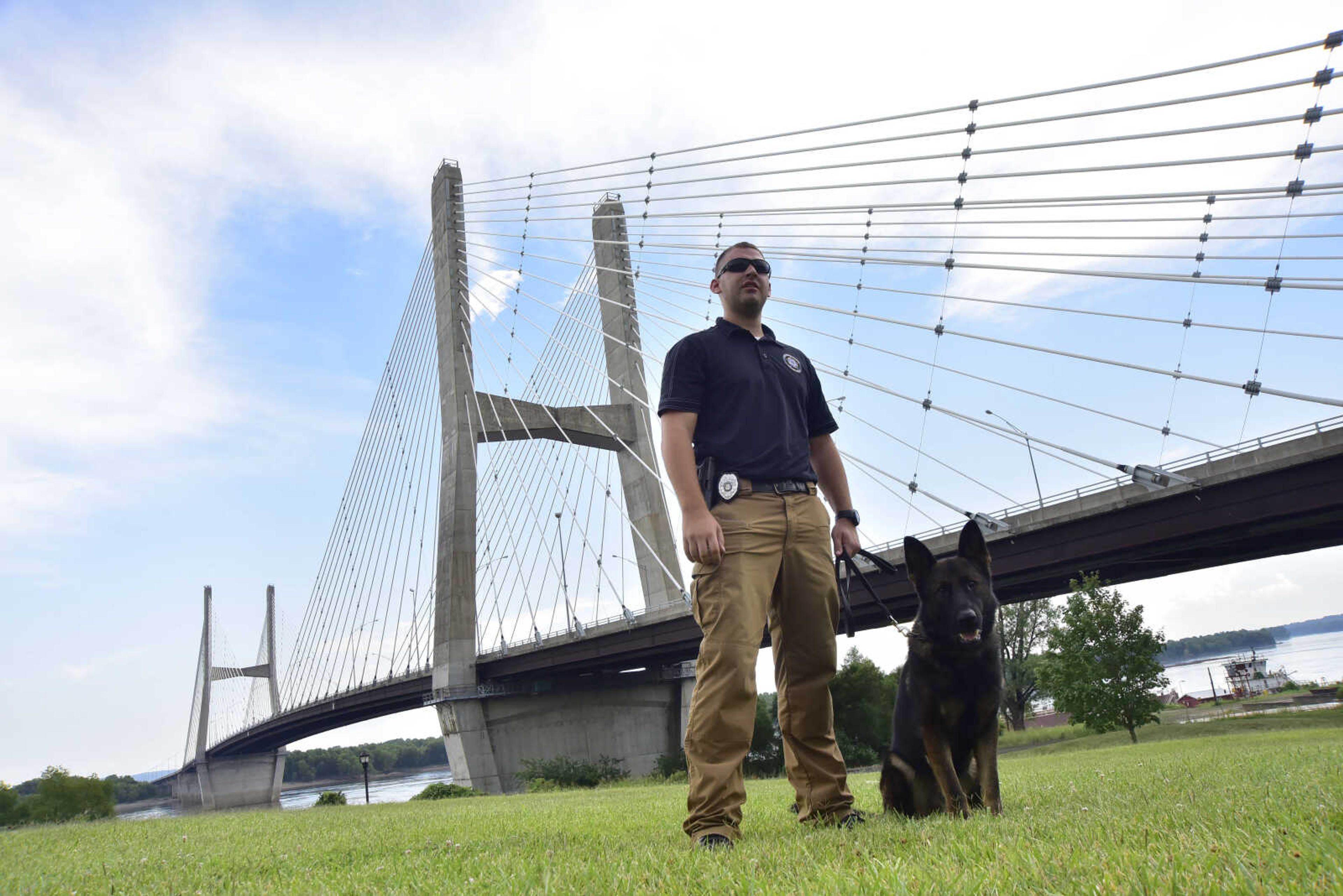 Officer Eric Steiner and K-9 officer Dallas pose for a photo outside of the Southeast Missouri State River Campus Monday, July 17, 2017 in Cape Girardeau.