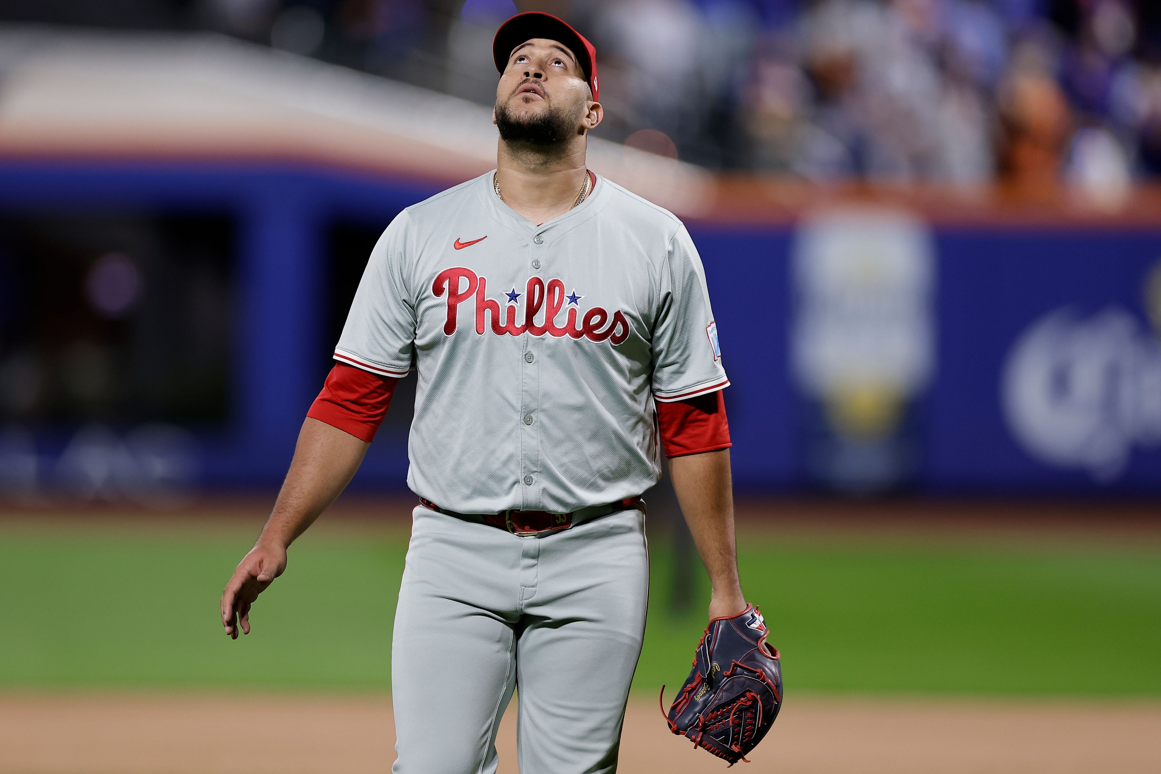 RETRANSMISSION TO CORRECT ID - Philadelphia Phillies reliever Carlos Estévez walks off the field at the end of the sixth inning after giving up a grand slam home run to the New York Mets during Game 4 of the National League baseball playoff series, Wednesday, Oct. 9, 2024, in New York. (AP Photo/Adam Hunger)