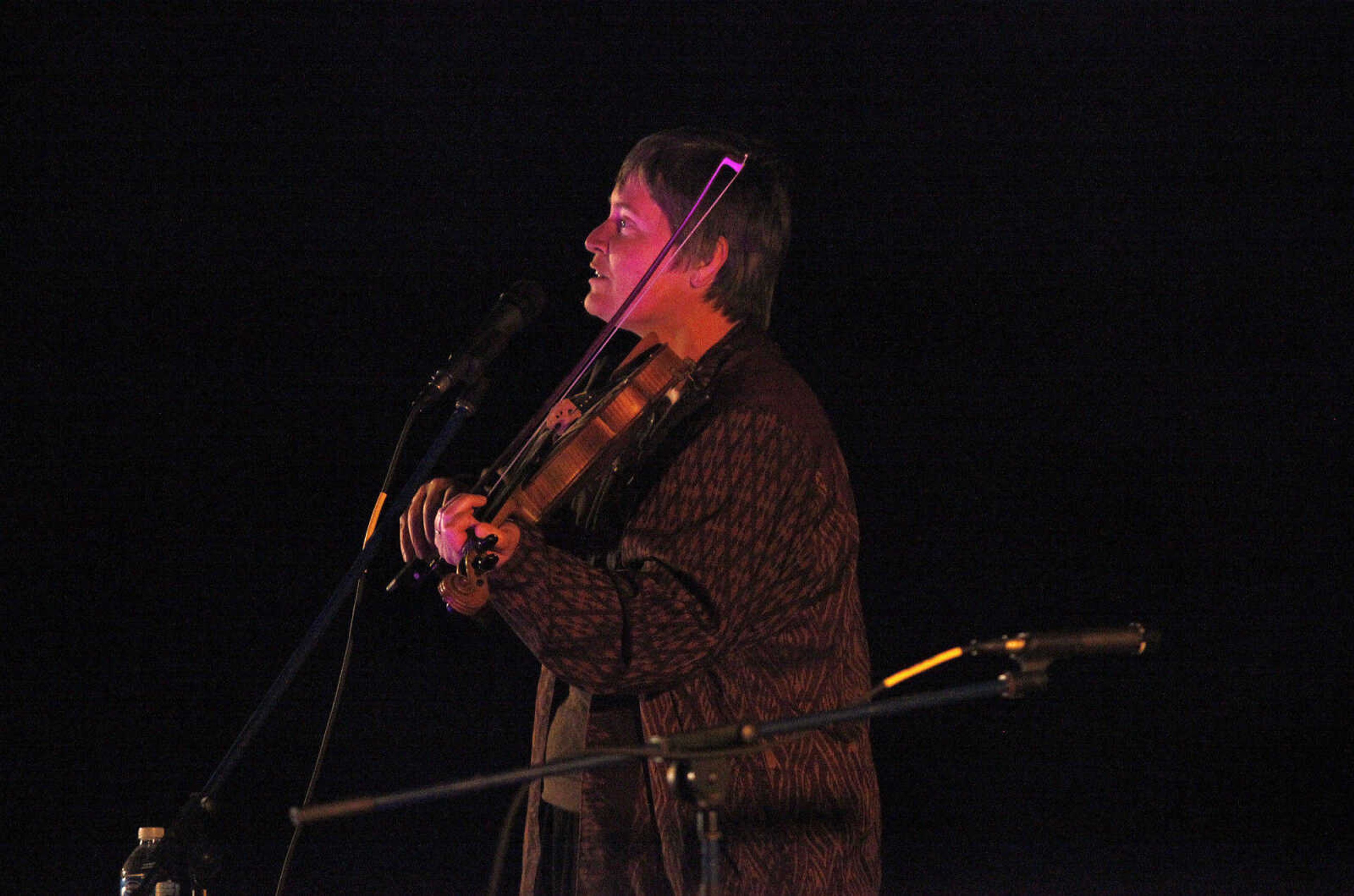 CHRIS MACKLER ~ photos@semissourian.com

Storyteller Jennifer Armstrong plays her fiddle during the Ghost Storytelling Festival held near the Old Beech Tree on the east lawn of Southeast Missouri State University's River Campus in Cape Girardeau on Friday, Oct. 15, 2010. According to Chuck Martin, Executive Director of the Cape Girardeau Convention and Visitors Bureau, around 650 people attended the event.