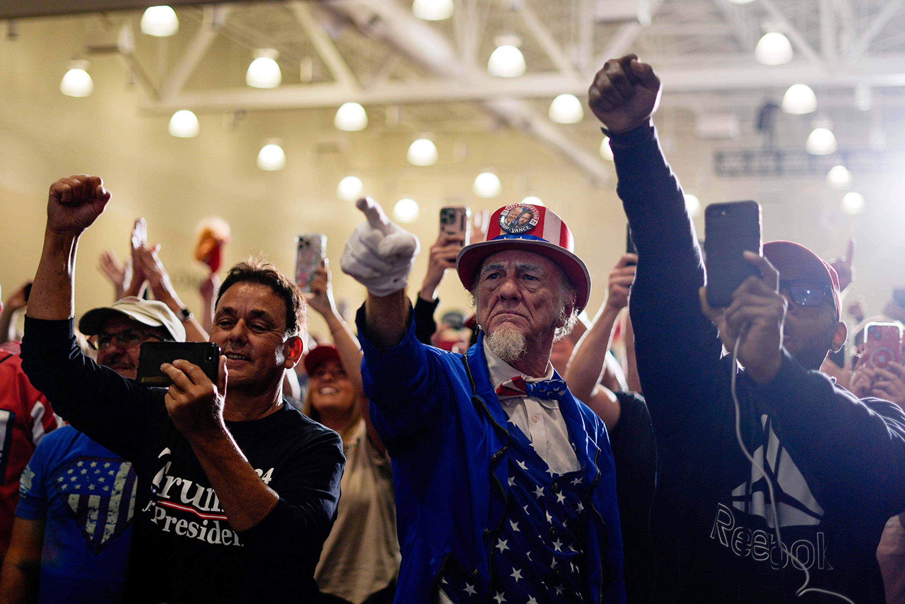 Supporters cheer as Republican presidential nominee former President Donald Trump speaks during a campaign event, Sunday, Sept. 29, 2024, in Erie, Pa. 