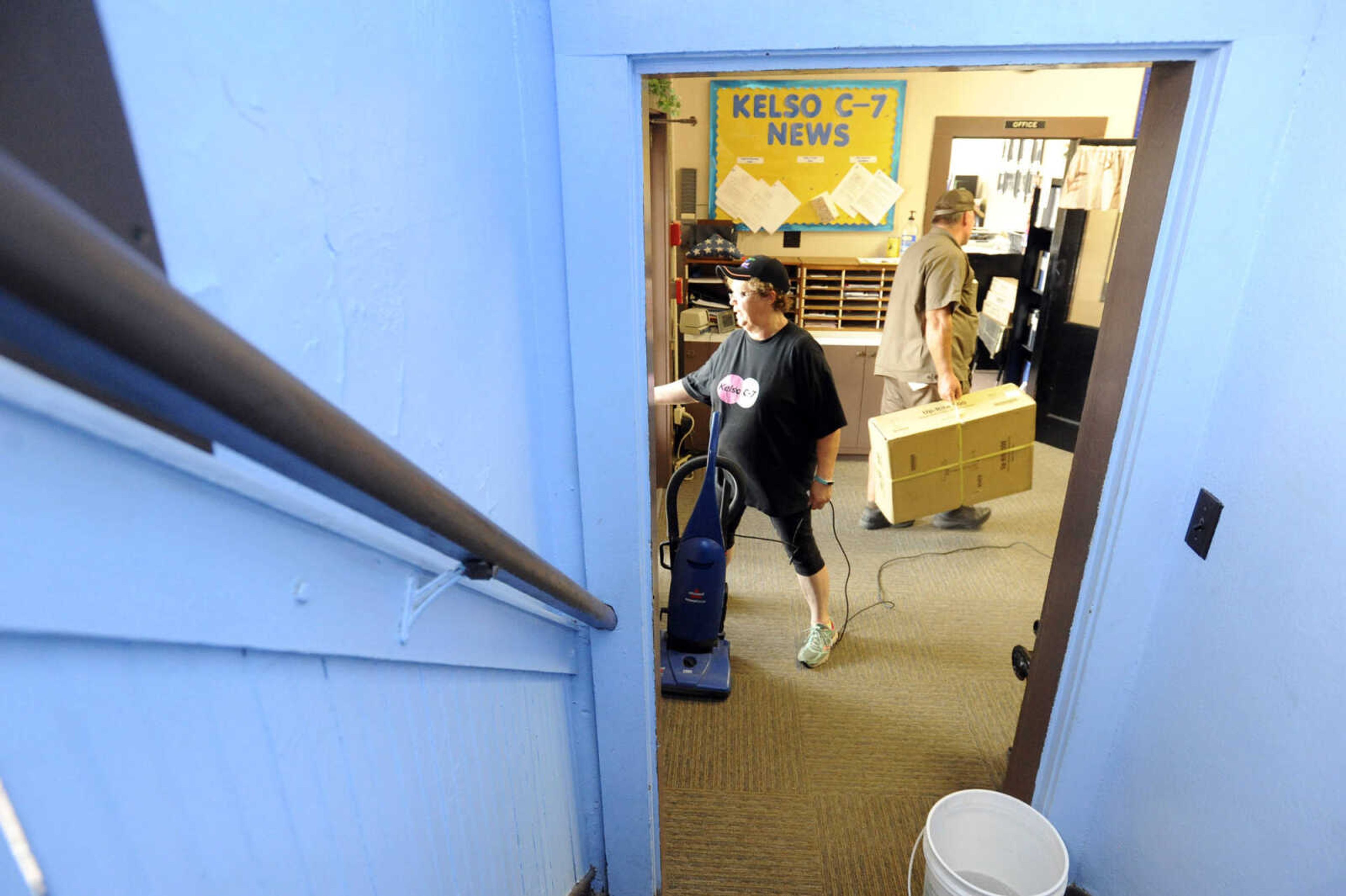 LAURA SIMON ~ lsimon@semissourian.com

Laura Orr breaks from vacuuming the entryway of Kelso C-7 School in New Hamburg, Missouri to let in a delivery driver on Thursday, July 14, 2016. Orr, who has worked at the school for 29 years as a bus driver and cook, was helping to tidy up before the weekend.