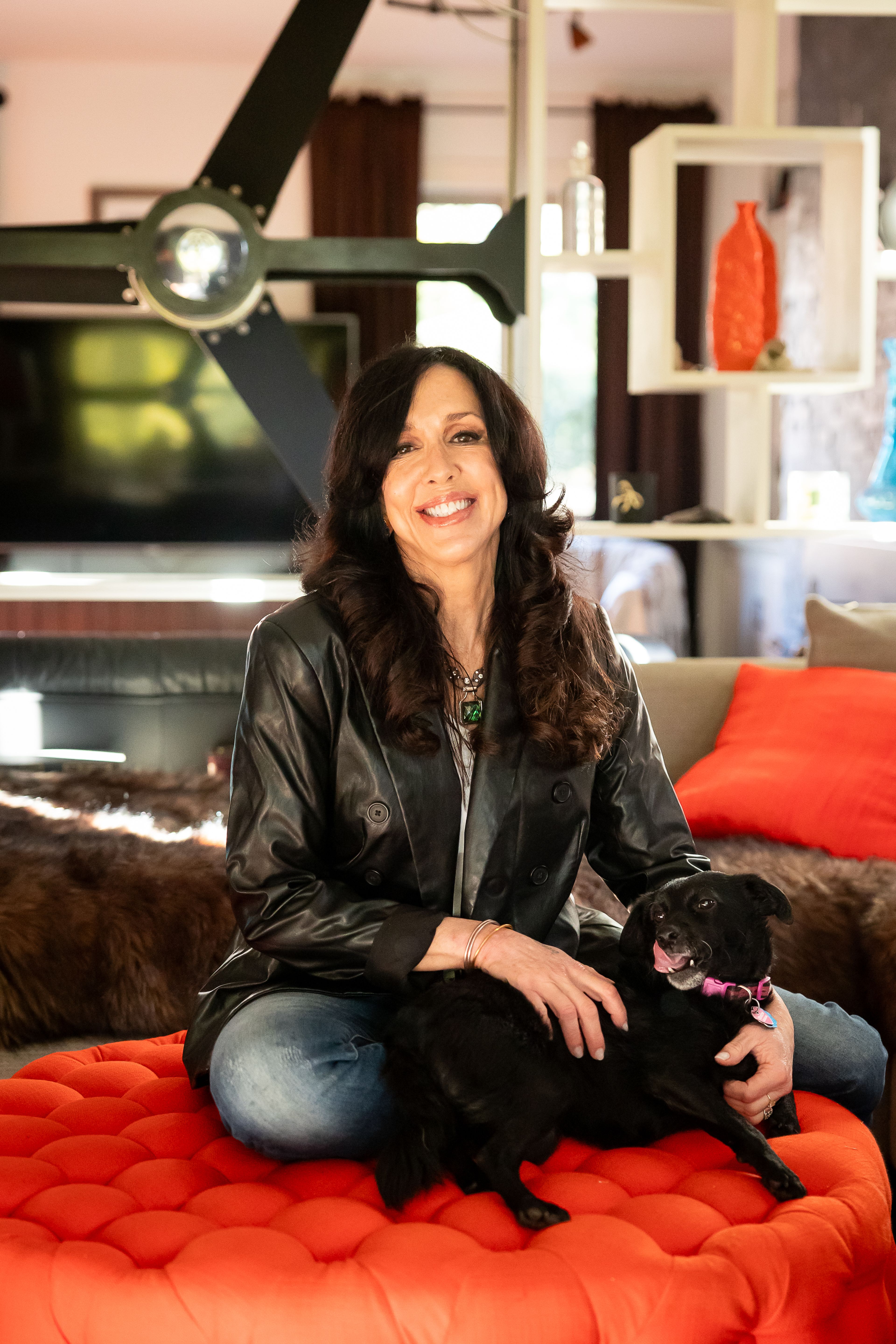 Tamatha Crowson of Cape Girardeau sits in her living room with her dog. Crowson prepares vibrant meal-prep favorites, including her Mexican fiesta bowl and Asian ginger garlic bowl, weekly.
