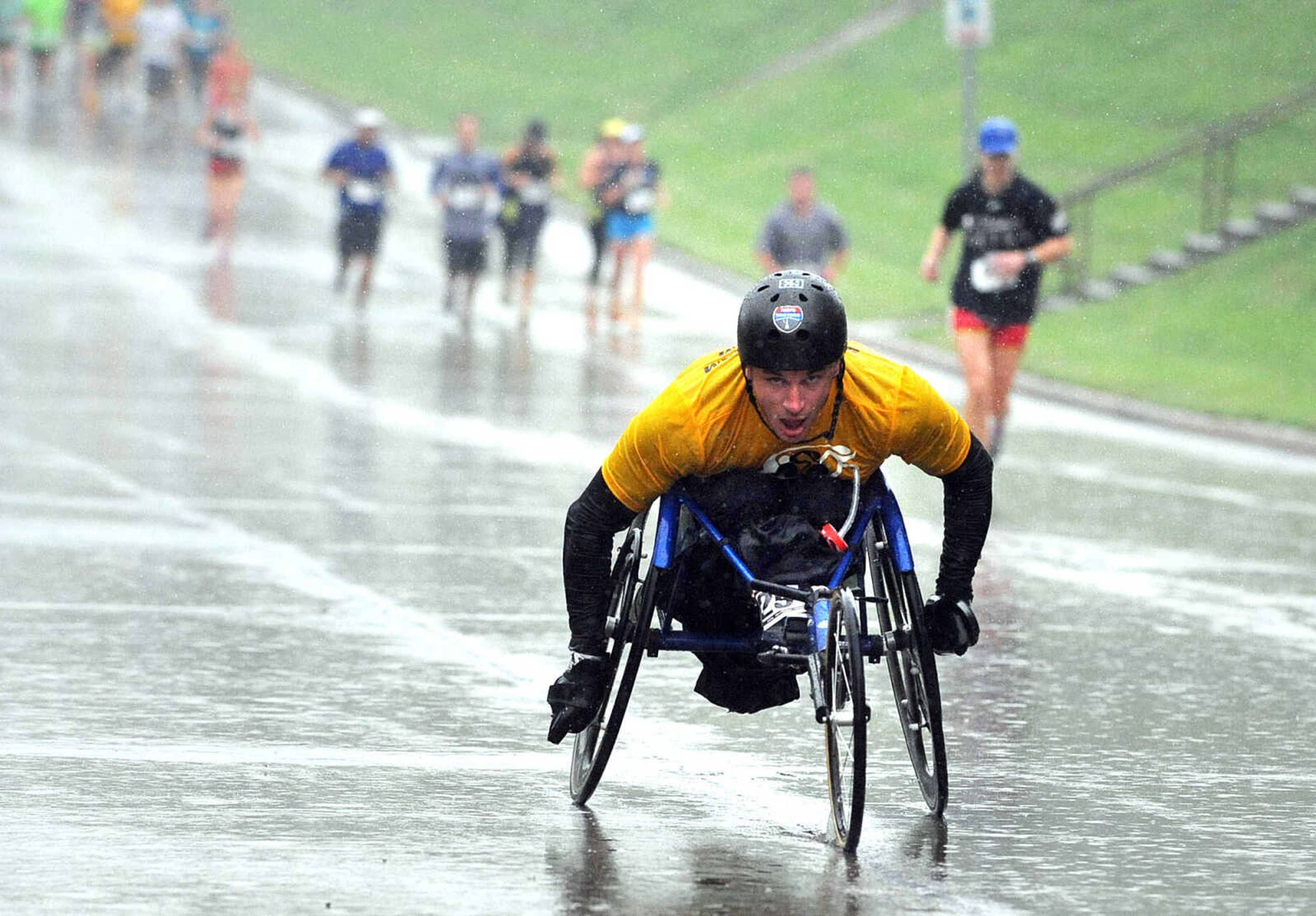 LAURA SIMON ~ lsimon@semissourian.com
Participants trek through the rain in Cape Girardeau Sunday morning, Sept. 16, 2012 during the City of Roses half marathon and 5k.