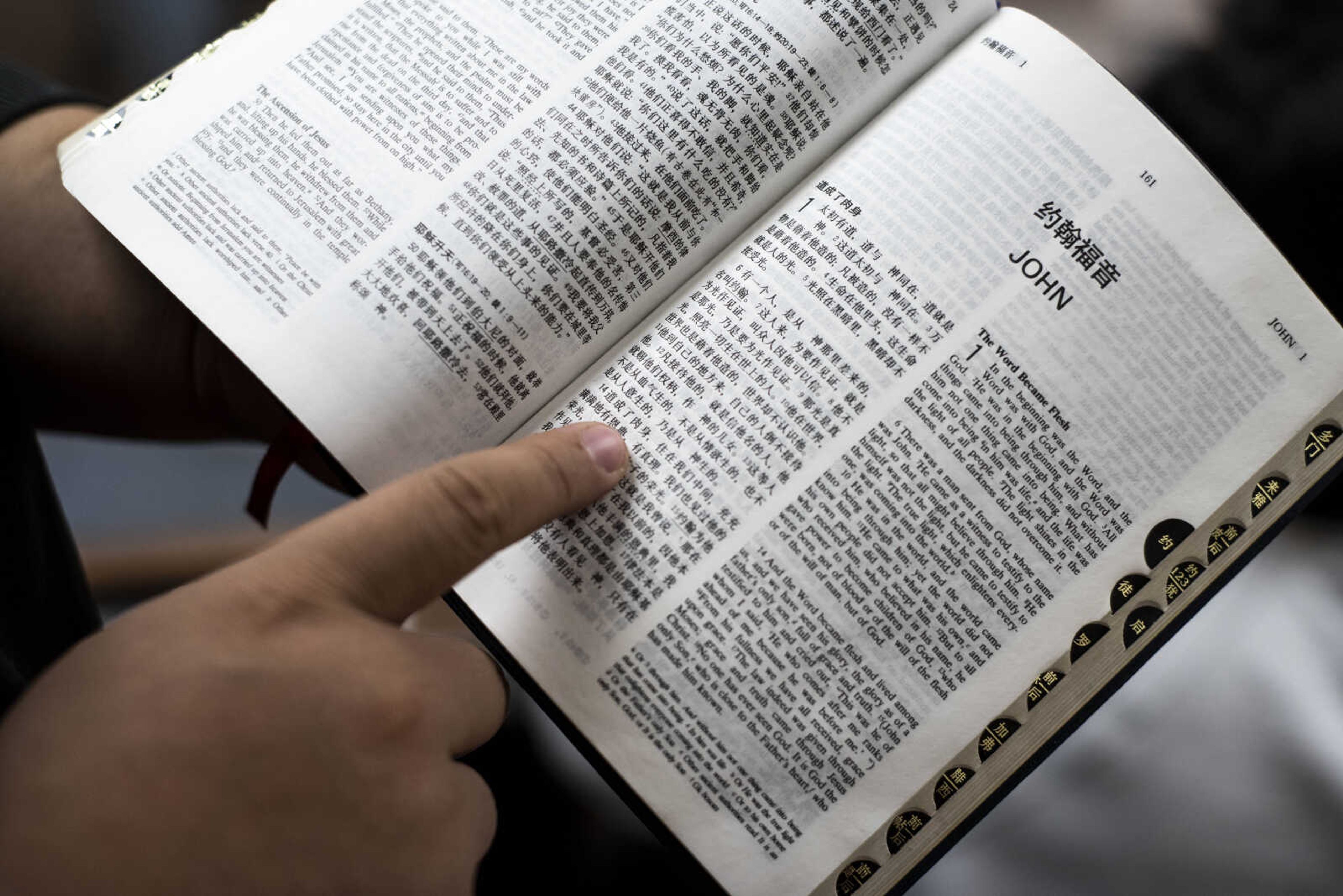 Wuwei (Peter) Lan points to his favorite Bible verse, John 3:16, written in Mandarin Friday, March 8, 2019, at the Southeast Missouri State University Baptist Student Center in Cape Girardeau.