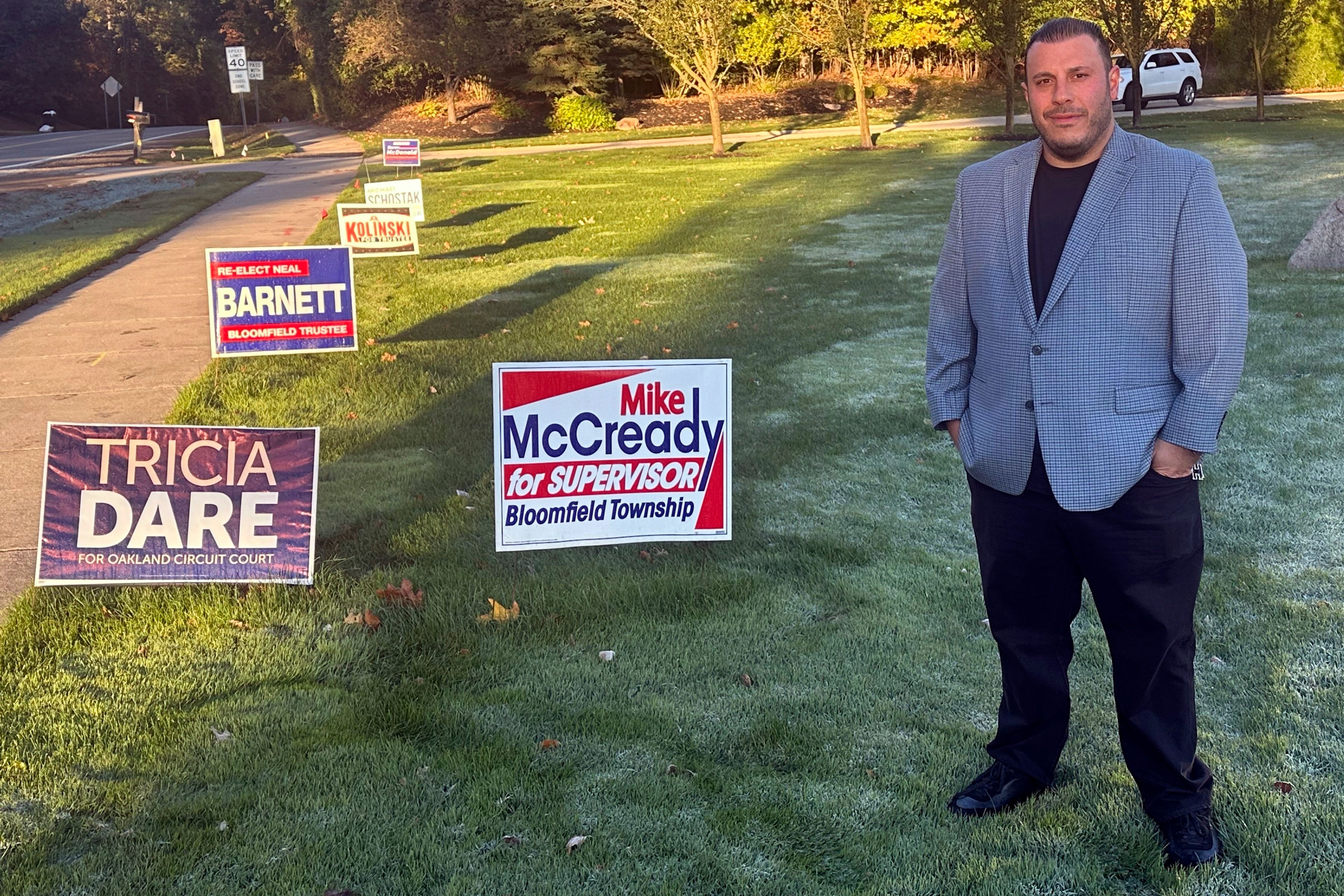 Nick Hannawa stands in his yard outside his home in Bloomfield Township, Mich., Thursday, Oct. 17, 2024. (AP Photo/Corey Williams)