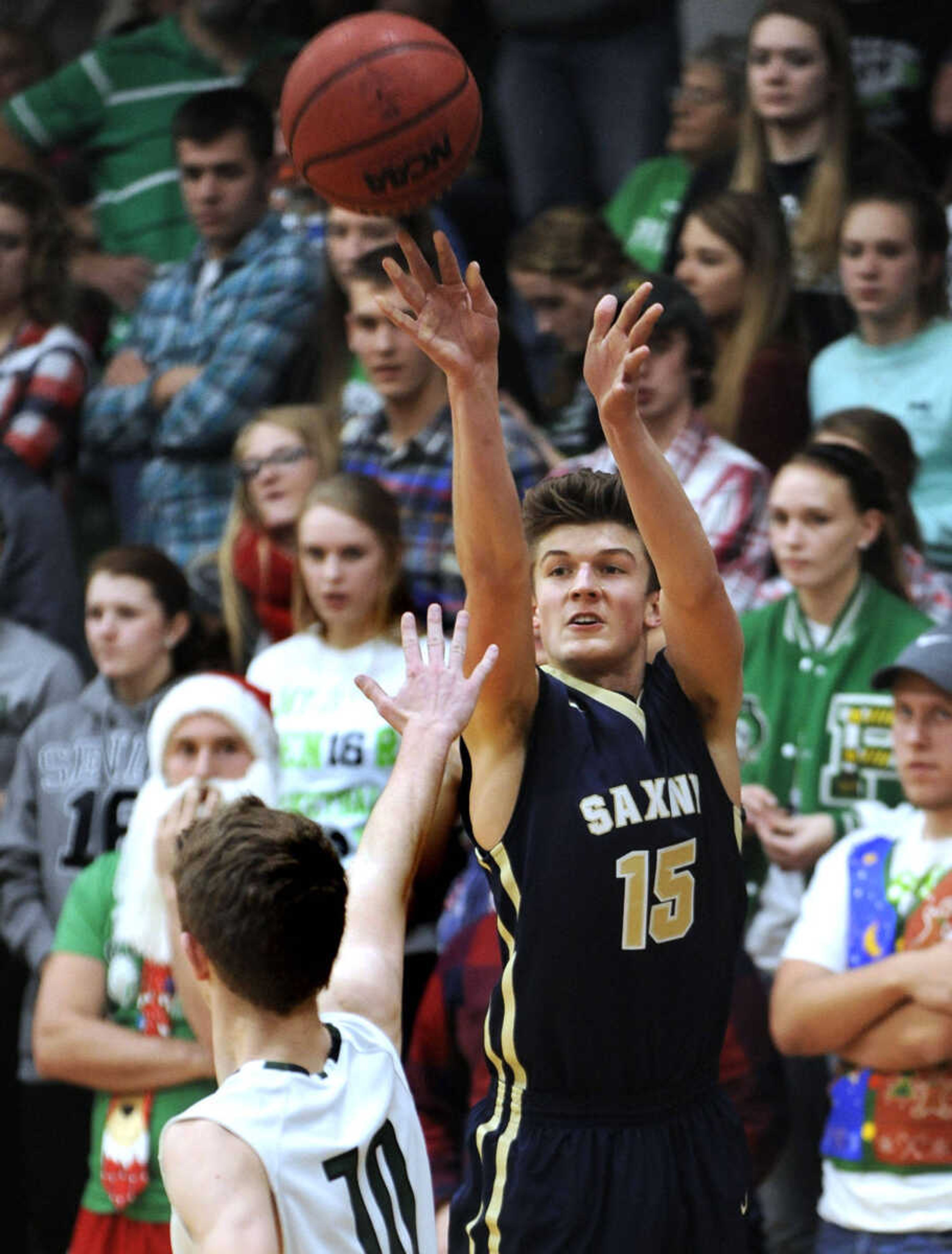 Saxony Lutheran's Graesen Meystedt attempts a 3-pointer over Perryville's Conner Stark during the second quarter Friday, Dec. 18, 2015 in Perryville, Missouri. (Fred Lynch)