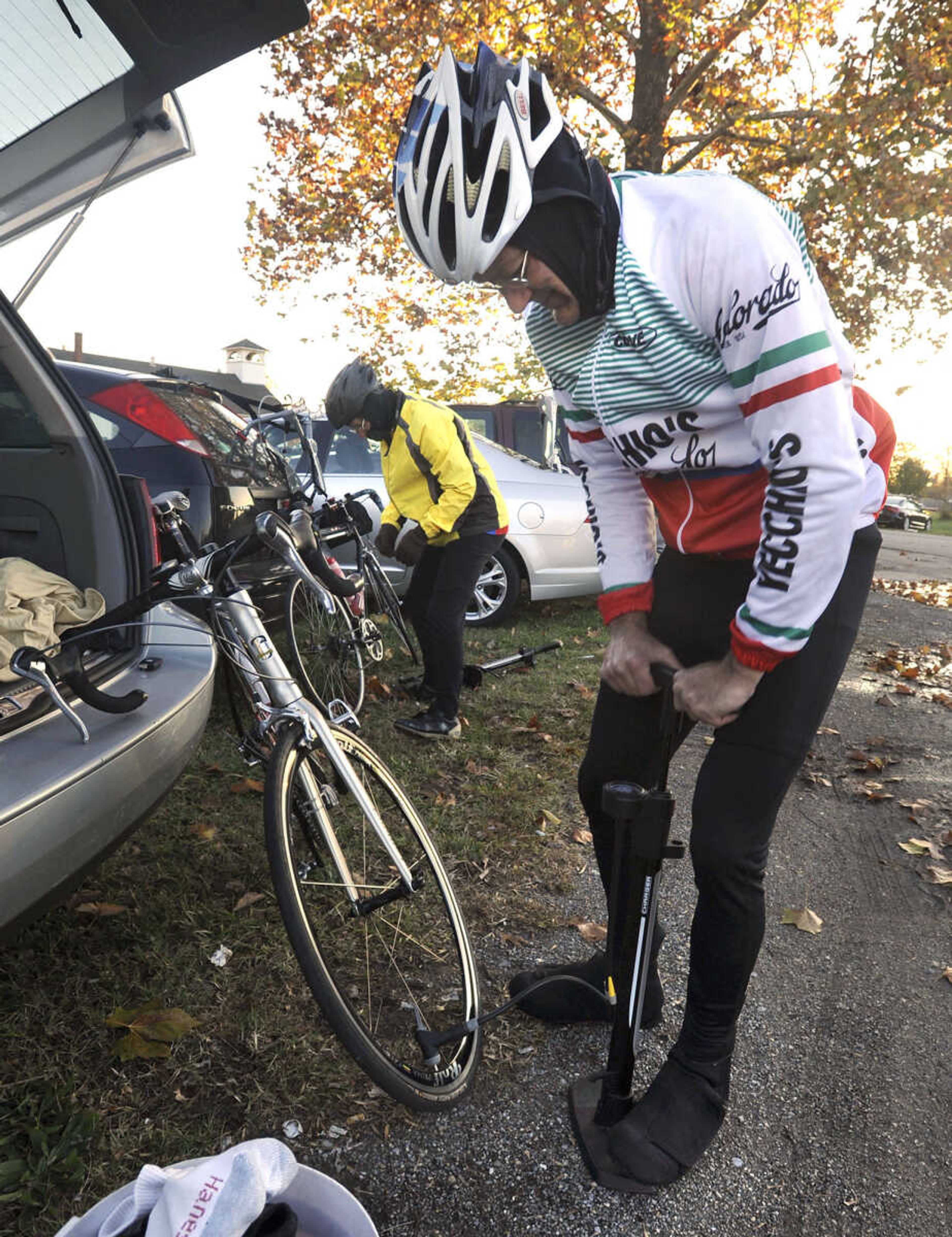 FRED LYNCH ~ flynch@semissourian.com
John Weiland of St. Peters, Mo. inflates his bicycle tires with Joe Kinsinger of Shepherdsville, Ky. before the Tour de Shawnee bicycle ride Saturday, Oct. 27, 2012 in Olive Branch, Ill.