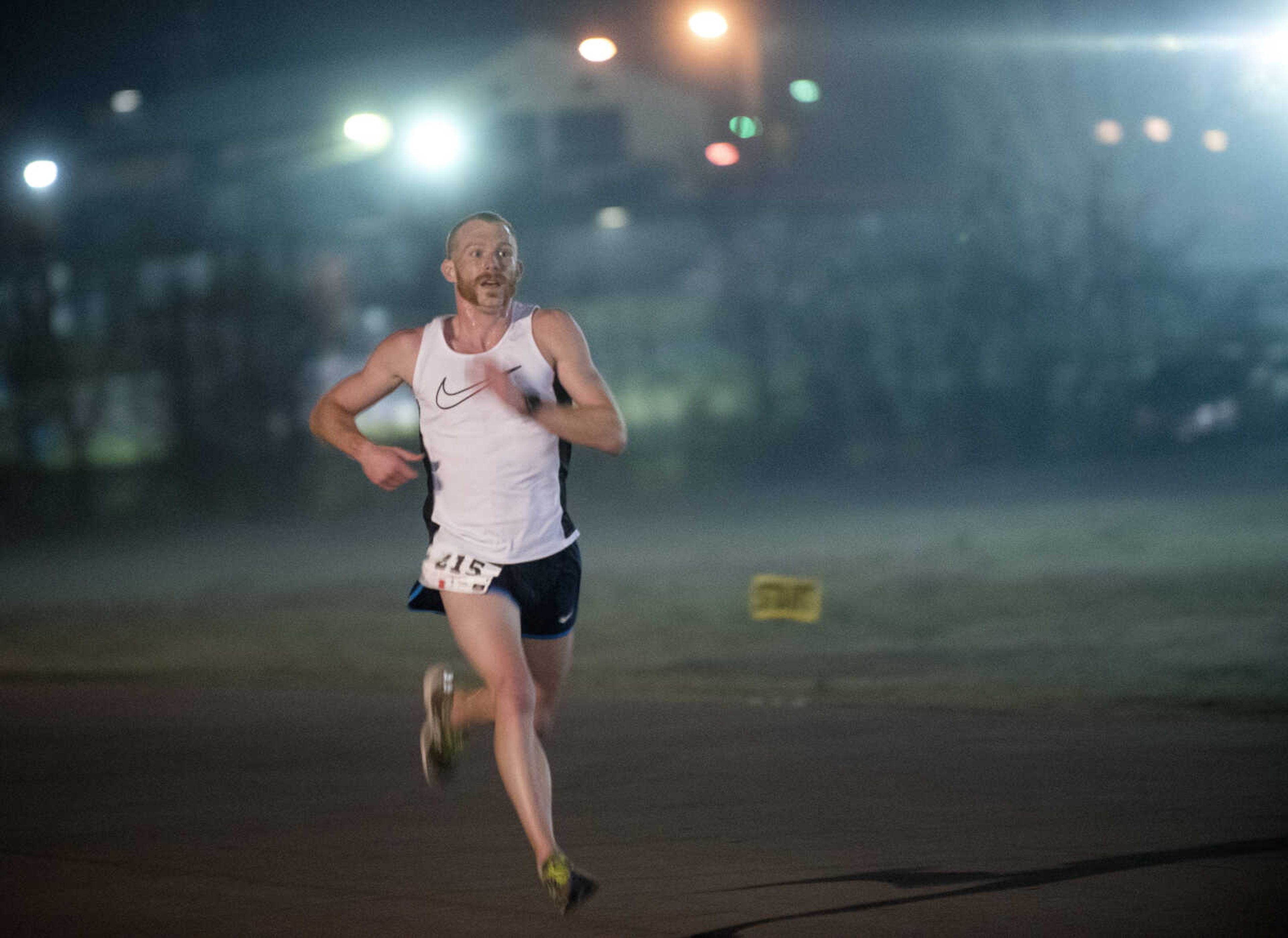 Matt Pfau runs towards the finish line for the midnight 5k during the 8th annual Howard Aslinger Endurance Run on Saturday, March 18, 2017 in Cape Girardeau.