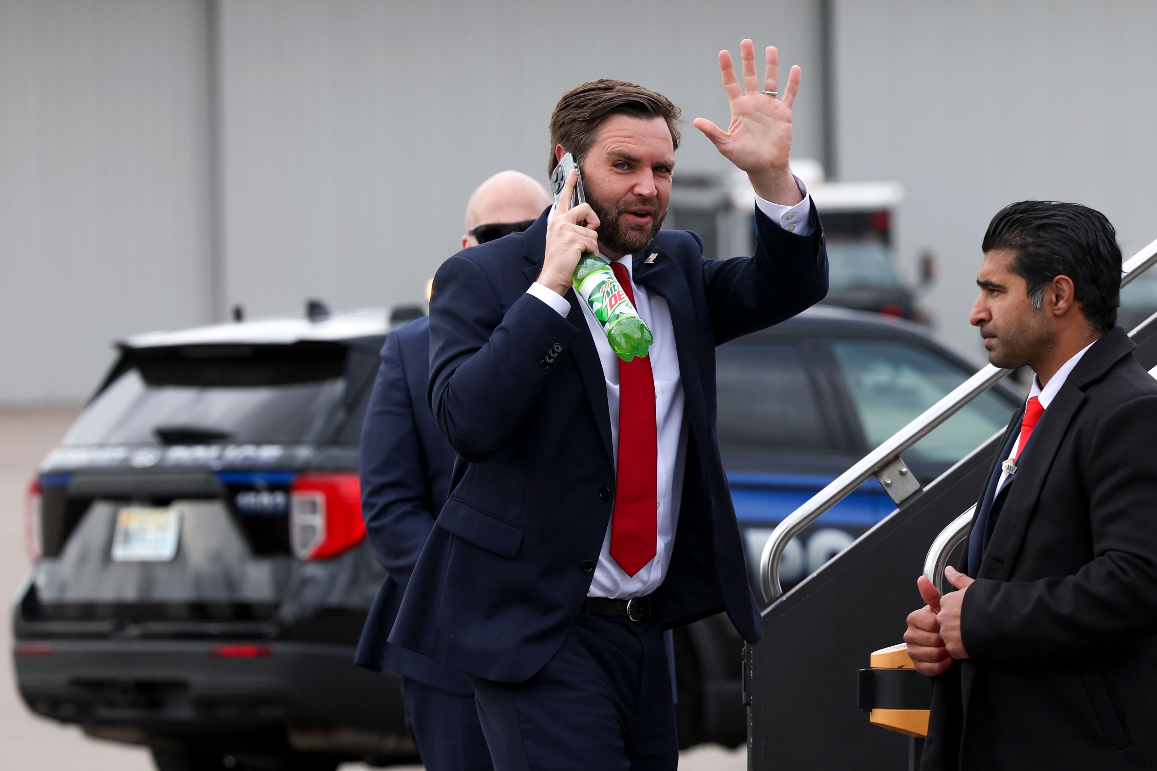 Republican vice presidential nominee Sen. JD Vance, R-Ohio, waves as he boards his plane at the Minneapolis/St. Paul International Airport, Monday, Oct. 14, 2024, after a campaign stop in Minneapolis. (AP Photo/Ellen Schmidt)