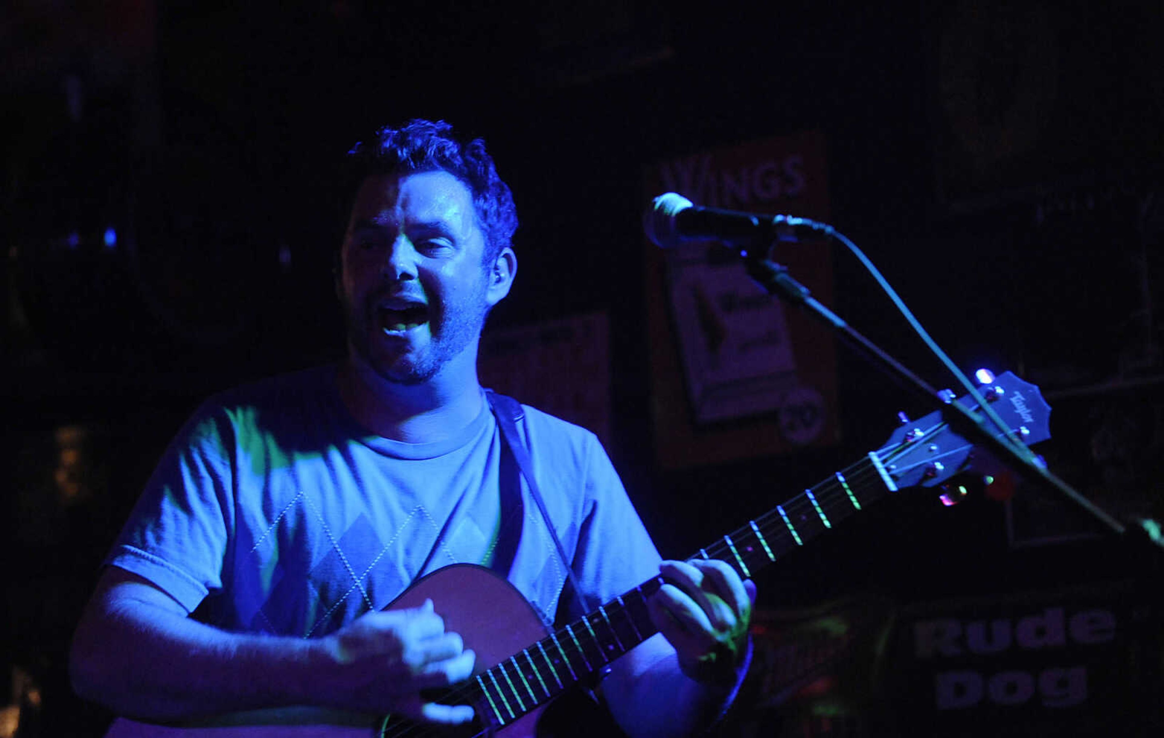 Mike Renick sings during a performance by the Mike Renick Band at the Rude Dog Pub, 123 Main Street, Friday, June 22.