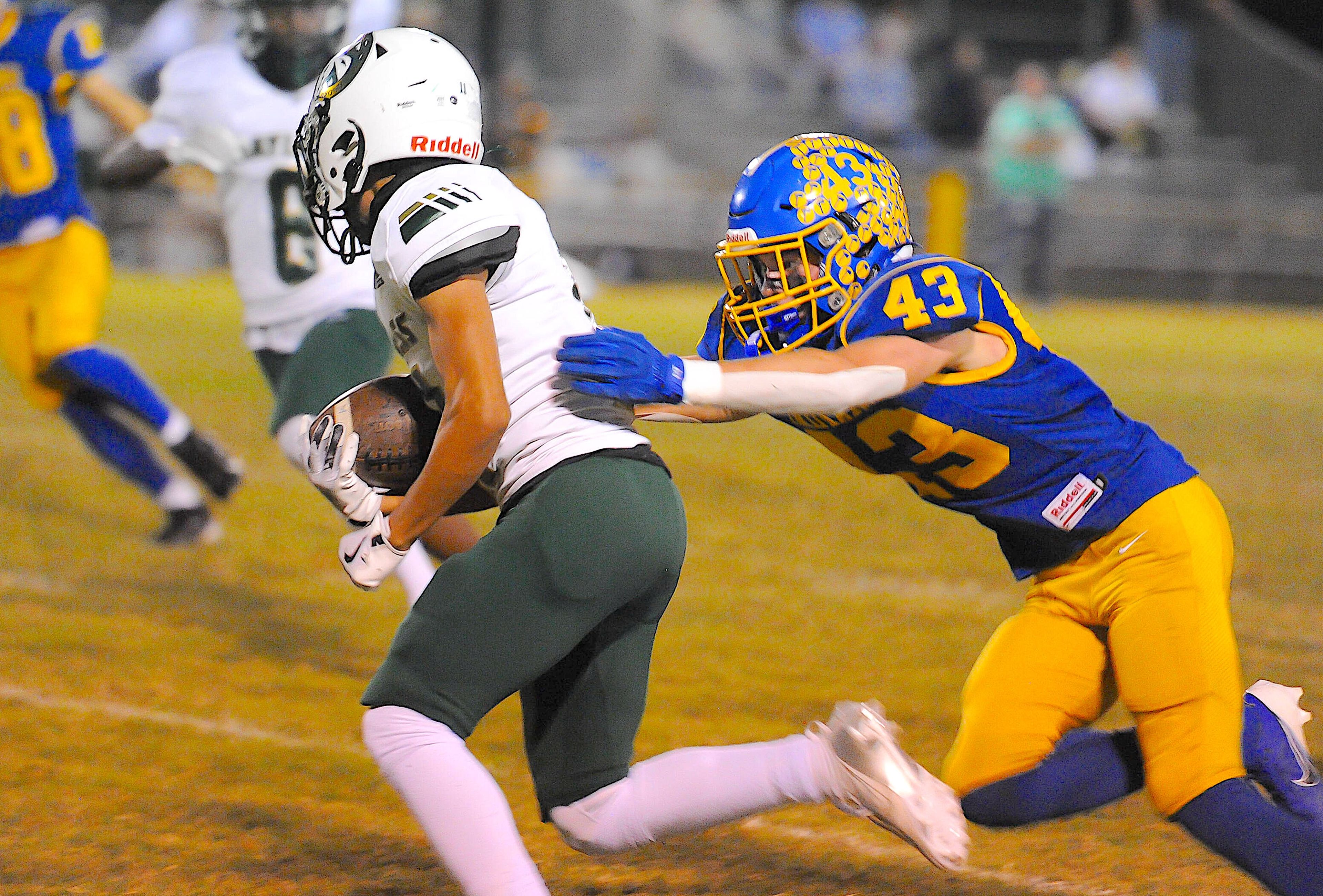 St. Vincent’s Carson House, right, wraps up a runner during a game between the St. Vincent Indians and the Bayless Bronchos on Friday, Oct. 4, at St. Vincent High School in Perryville. 