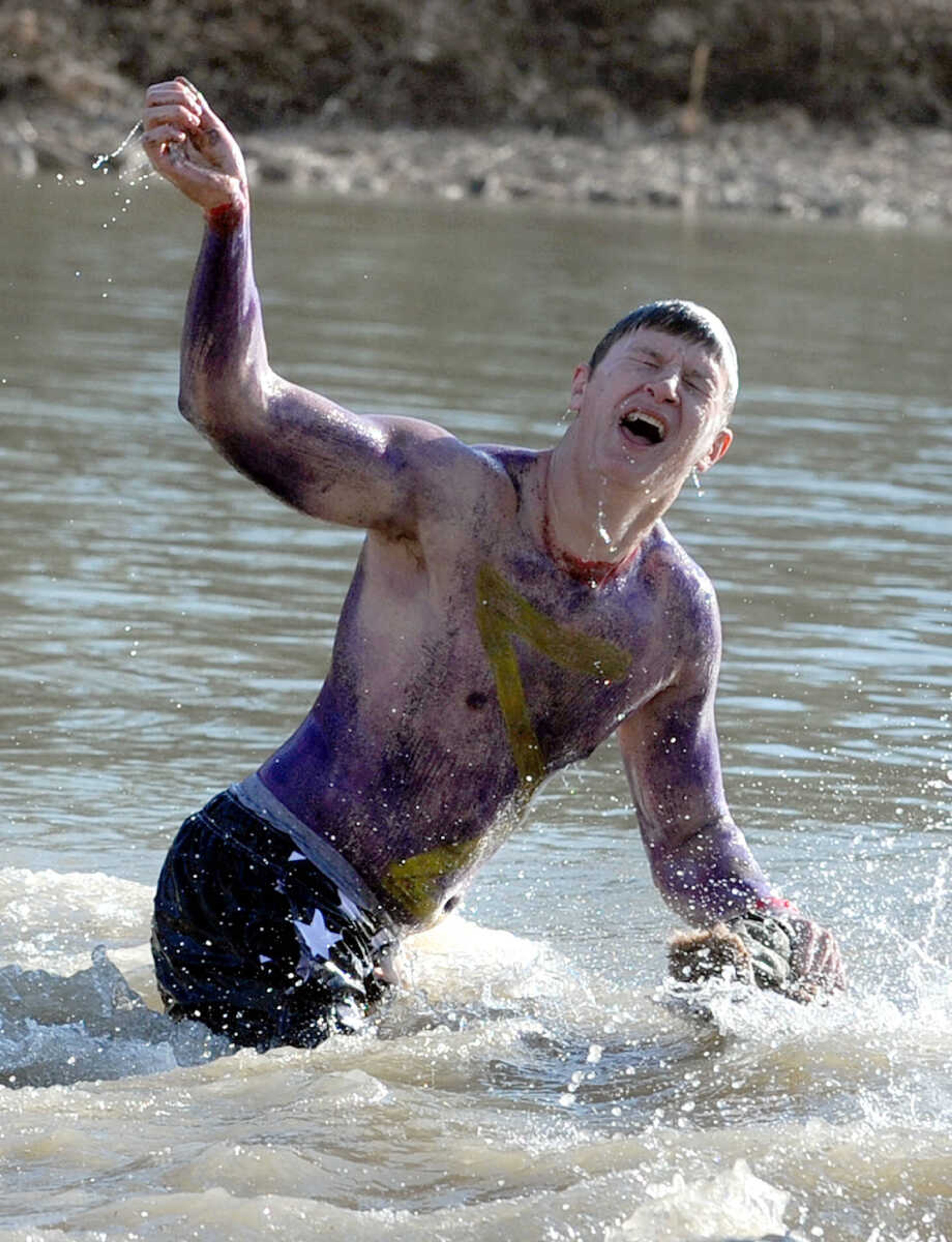 LAURA SIMON ~ lsimon@semissourian.com
People plunge into the cold waters of Lake Boutin Saturday afternoon, Feb. 2, 2013 during the Polar Plunge at Trail of Tears State Park. Thirty-six teams totaling 291 people took the annual plunge that benefits Special Olympics Missouri.