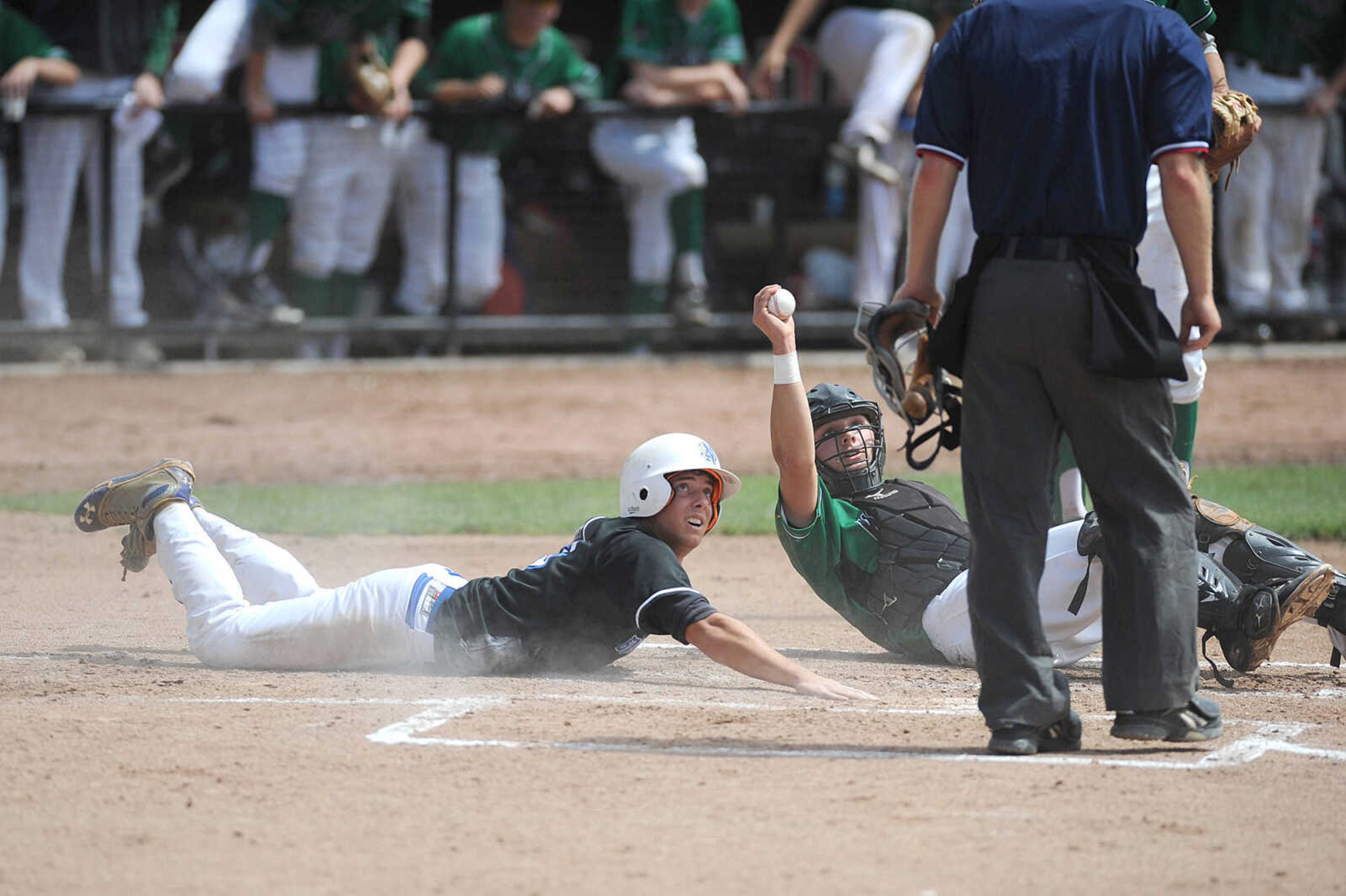 Notre Dame's Logan Heisserer slides safely into home around Smithville catcher Anthony Del Pico in the third inning of a Class 4 semifinal, Friday, June 5, 2015, in O'Fallon, Missouri. Notre Dame won 13-3 in six innings. (Laura Simon)