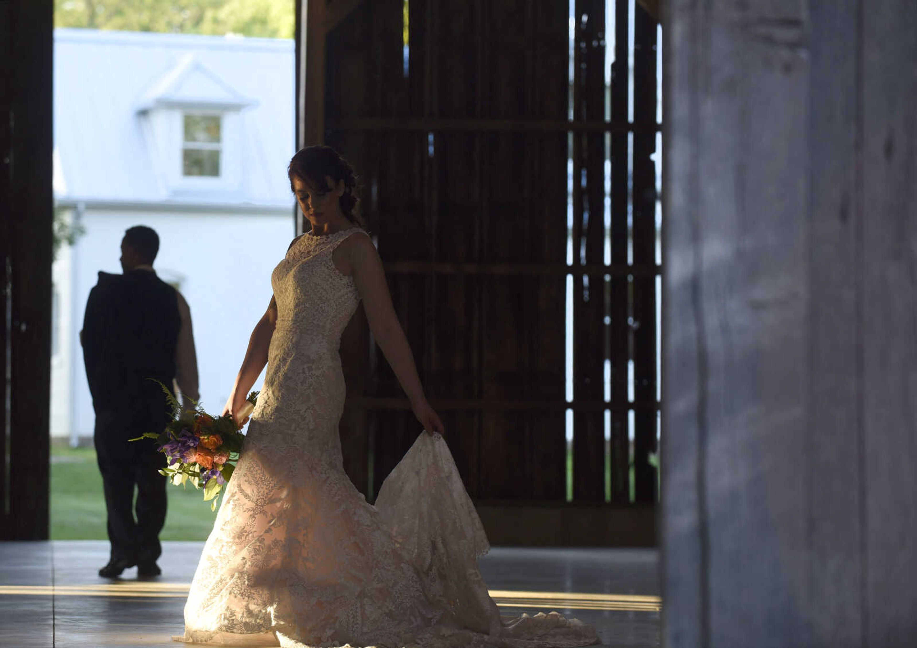 This Eddy K dress is a fit and flare, ivory on champagne colored gown. It has heavily embroidered symmetrical lace over velure tulle, with a detailed illusion back. Available at Ann-Louise Bridal in Jackson. 

Wedding suits courtesy of Jim's Formal Wear and available at Garber's Men's Wear in Cape Girardeau.