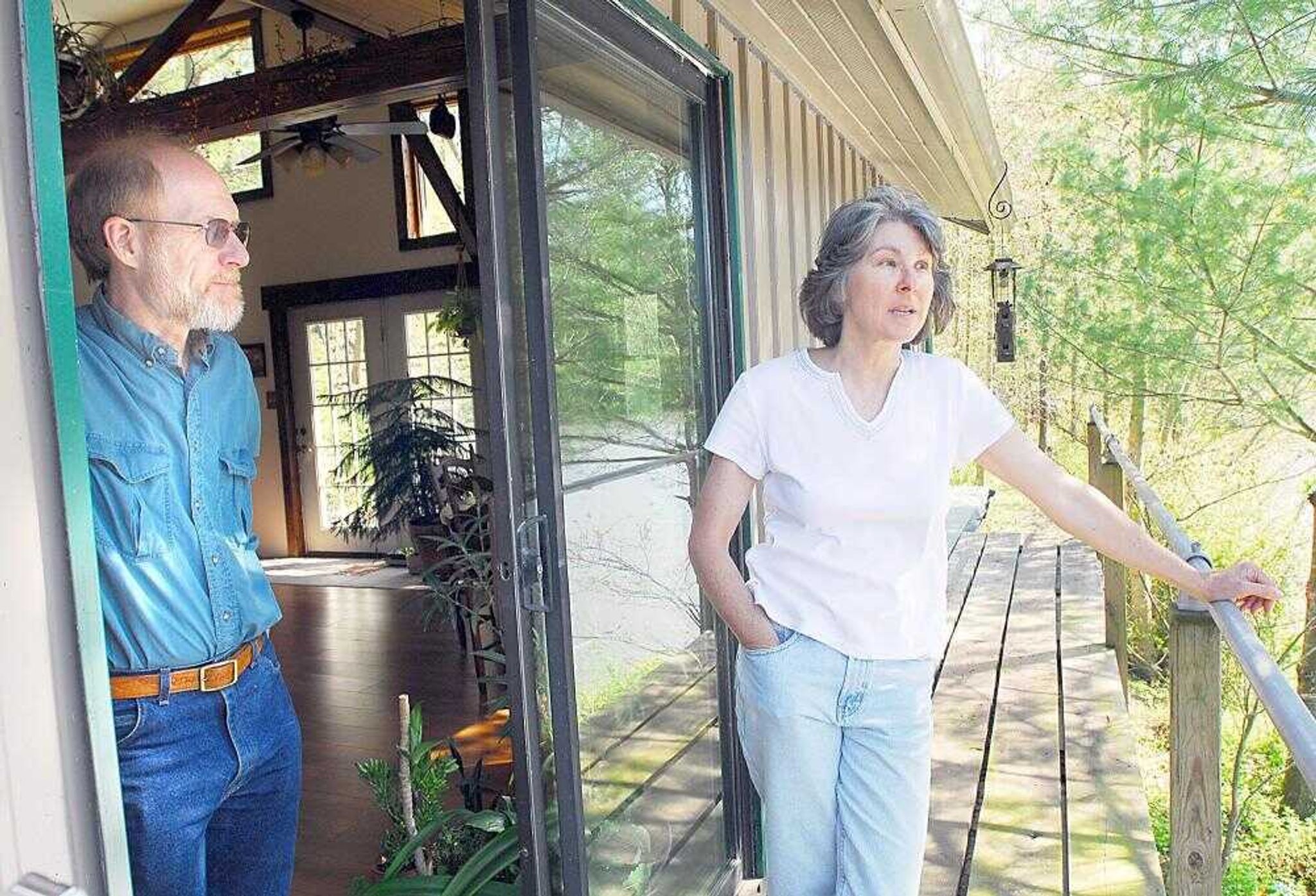 Jim Maginel and his wife Mary enjoy the view from their active solar powered home that took them 10 years to build in Olive Branch, Ill. (Diane L. Wilson)