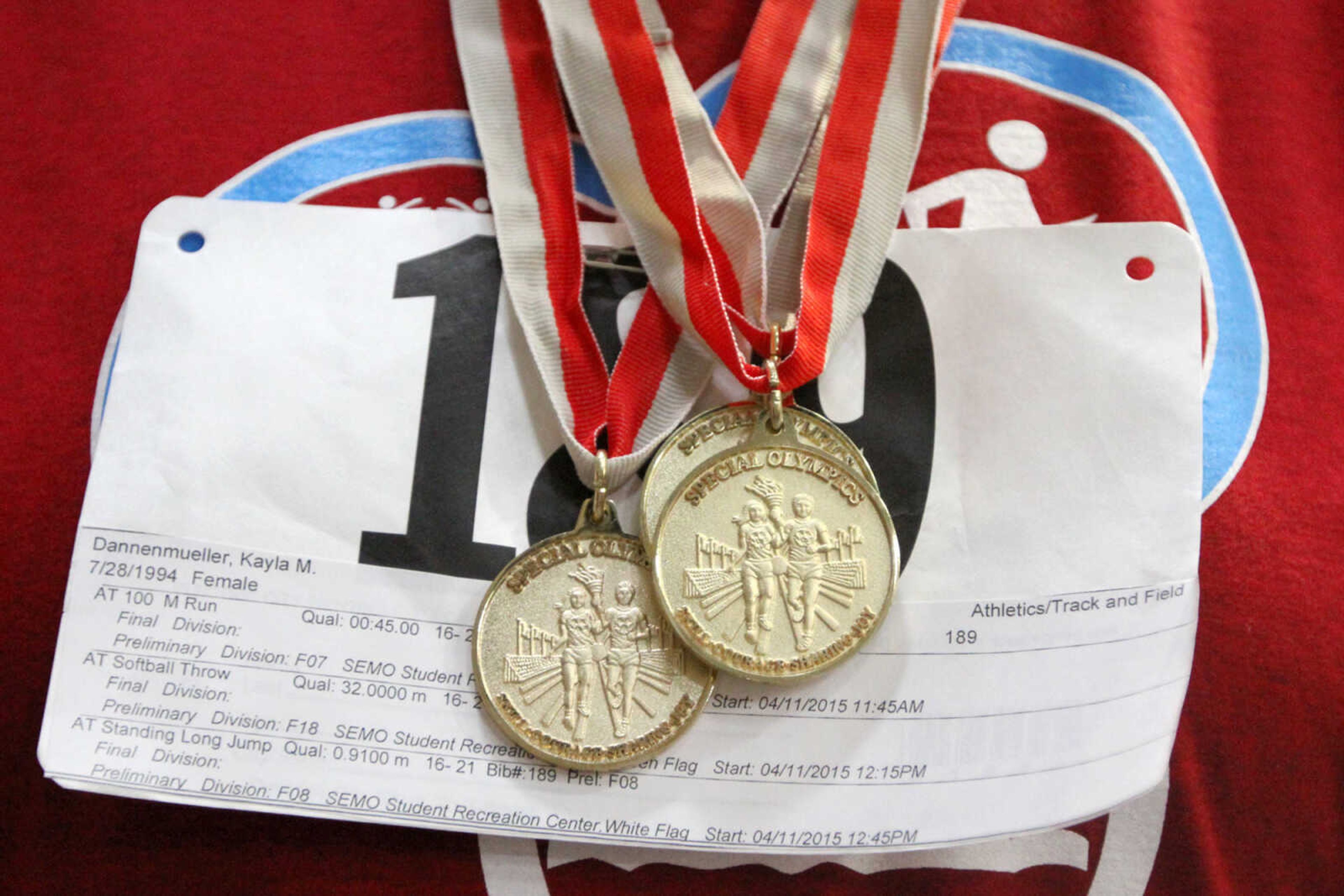 GLENN LANDBERG ~ glandberg@semissourian.com


Kayla Dannenmueller displays her three gold medals during the Missouri Special Olympics Southeast Area Spring Games Saturday, April 11, 2015 at the Student Recreation Center of Southeast Missouri State University.