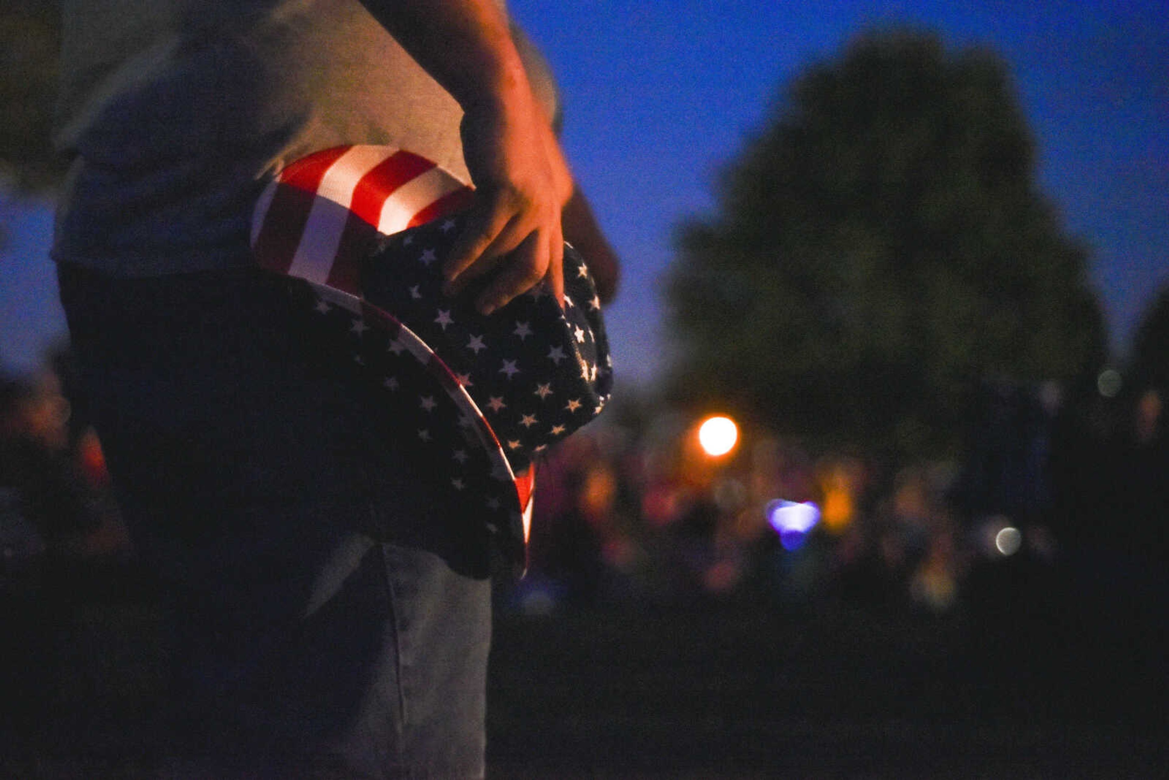 Shawm Lynn, of Cape Girardeau, holds his hat at his hip while standing for the Pledge of Allegiance on Tuesday, July 3, 2018, at the start of the Missouri Veterans Home fireworks show in Cape Girardeau.