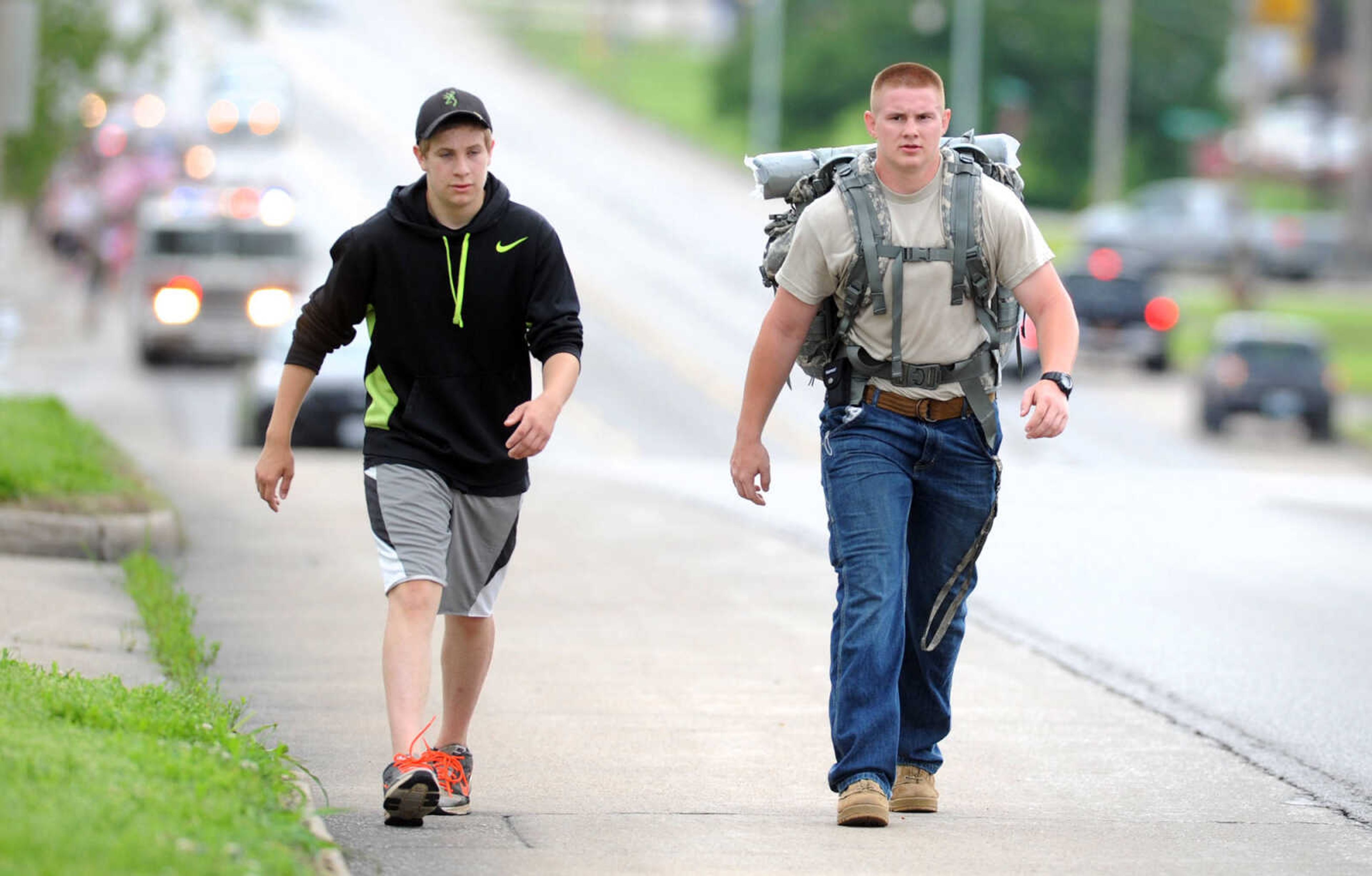 LAURA SIMON ~ lsimon@semissourian.com

Nathan Myers, left, and Andrew McMahon walk north on Kingshighway during the first ever Carry the Load event, Monday, May 25, 2015, in Cape Girardeau.