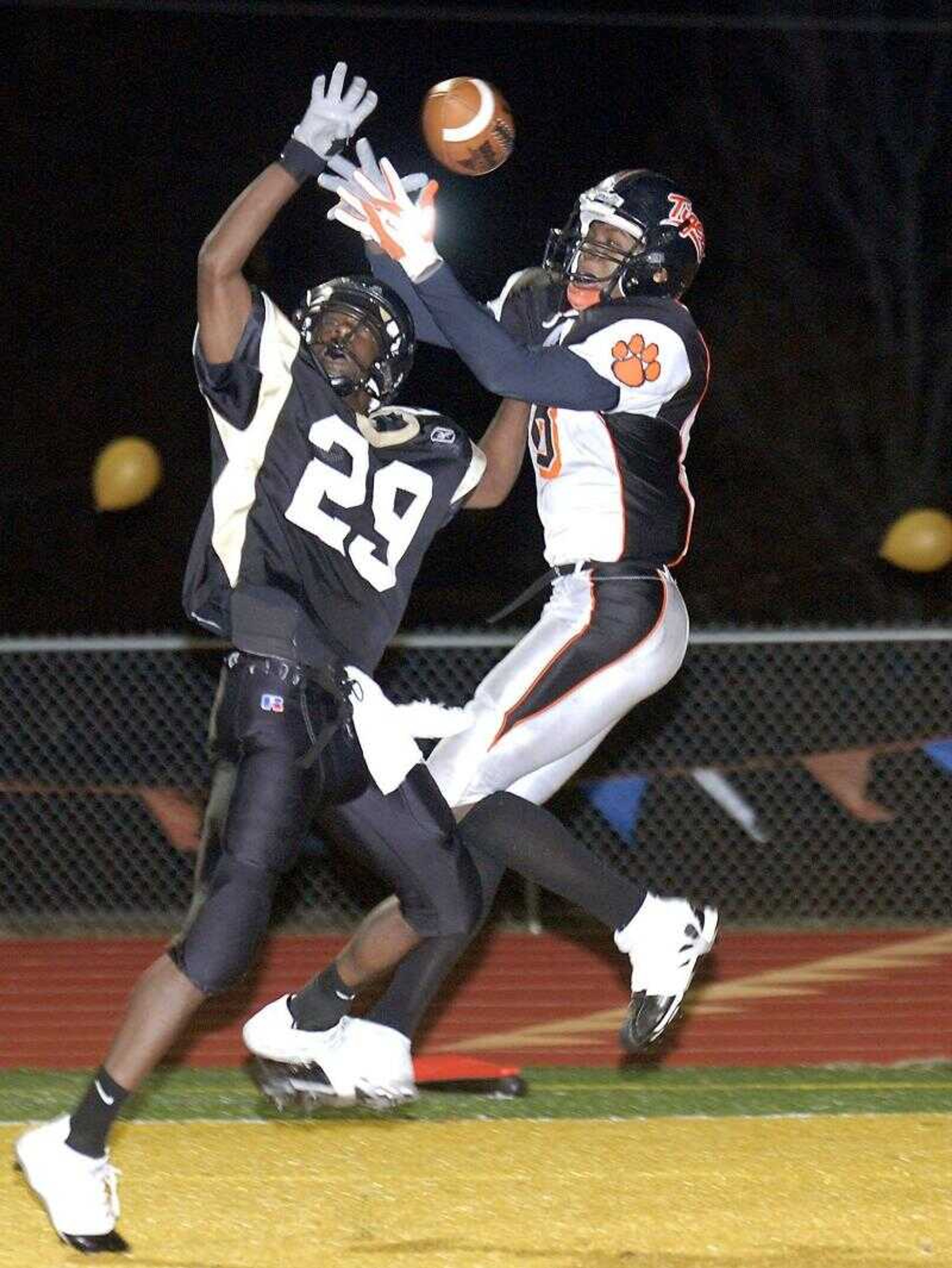 Farmington's Deon Glaspy, left, deflected a pass in the end zone that was intended for Central's George Hamilton during Wednesday's Class 4 sectional game in Farmington, Mo.