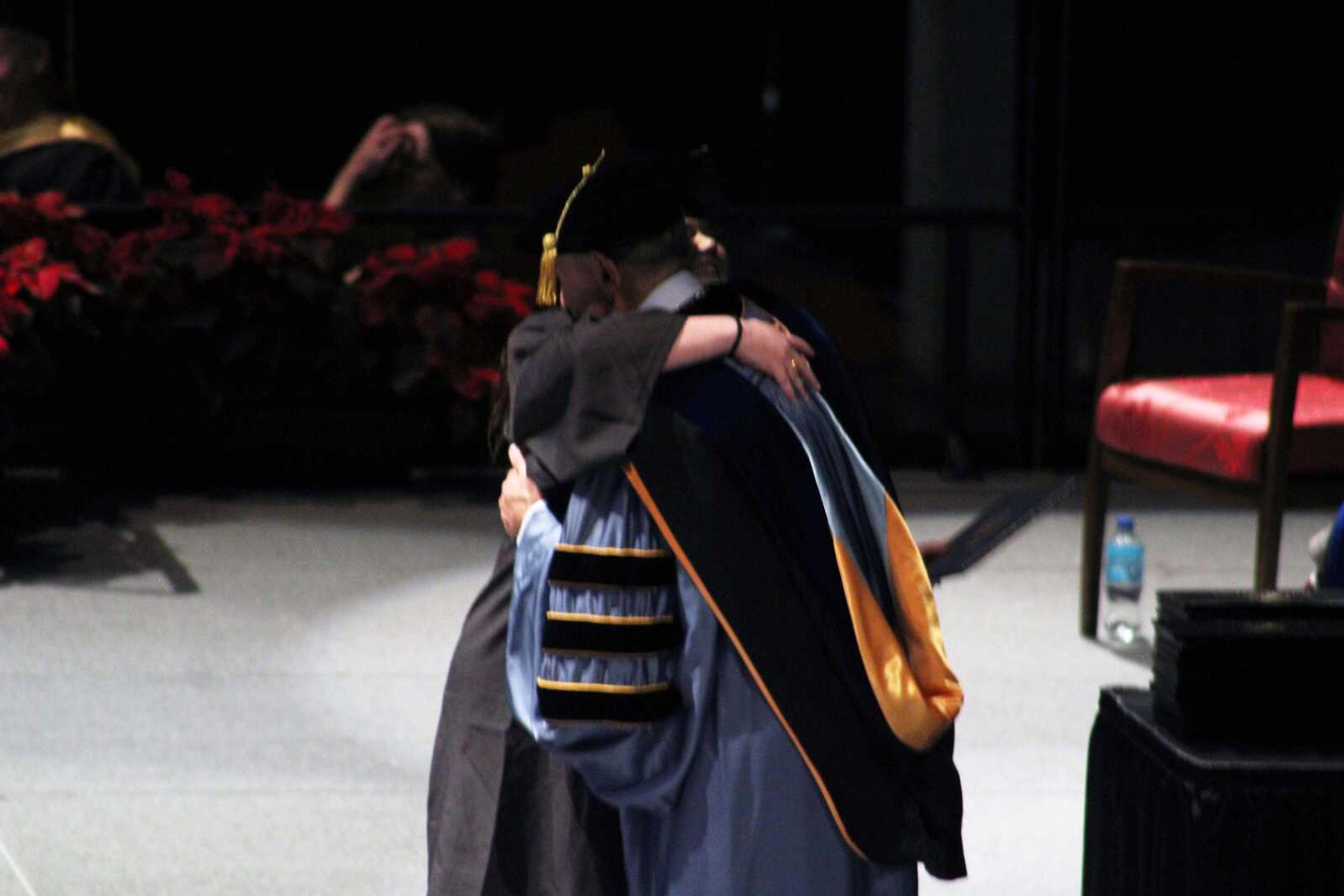 A Southeast Missouri State University graduate hugs President Carlos Vargas after receiving her diploma during SEMOвЂ™s afternoon Fall Commencement Ceremony Saturday, Dec. 18, 2021, at the Show Me Center in Cape Girardeau.