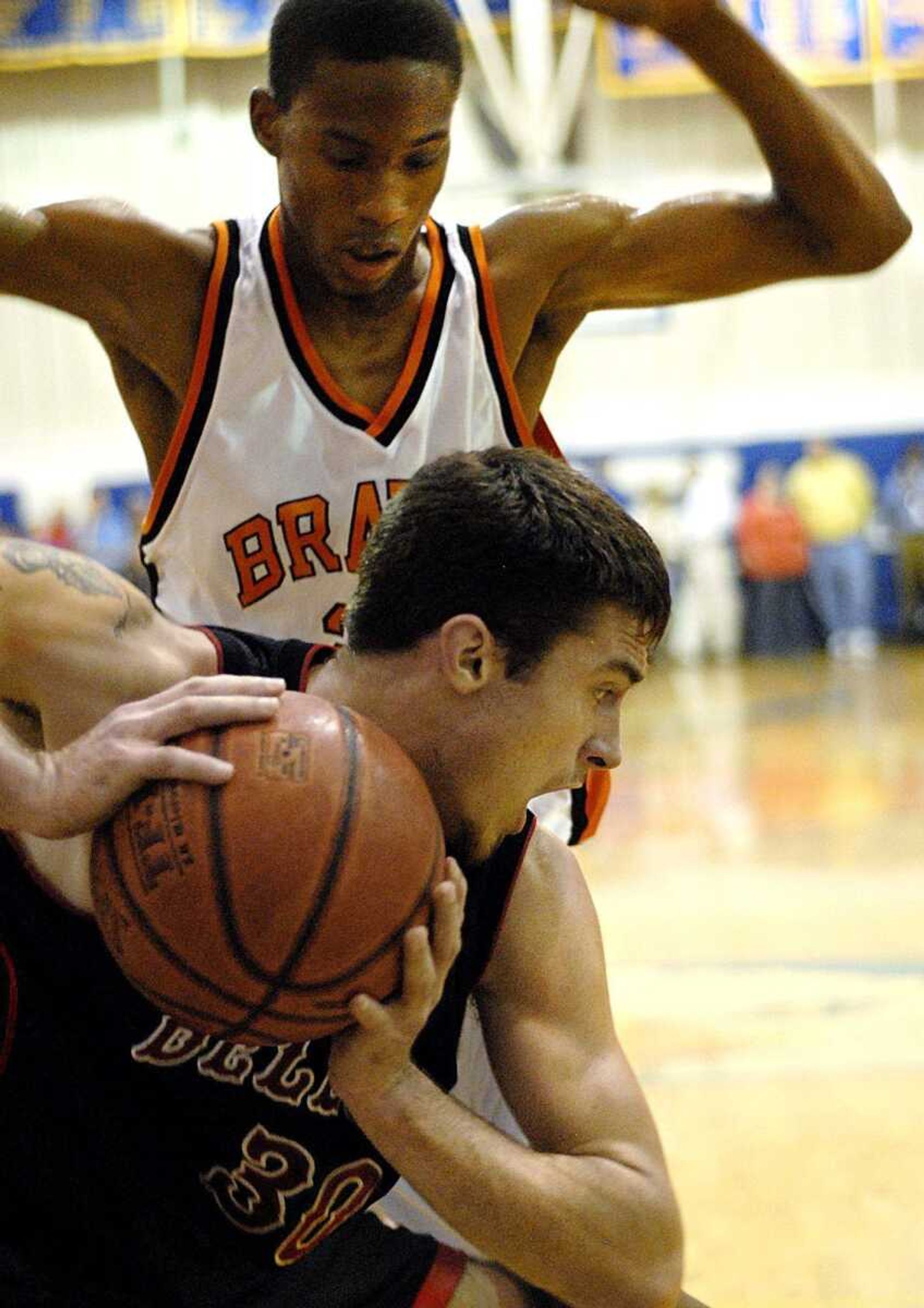 Bell City senior Marty Dames grabbed a rebound in front of Scott County Central junior Randy Timmons during the Oran Invitational title game last month. Dames and the Cubs will try to repeat as Southeast Missourian Christmas Tournament champions. (Aaron Eisenhauer)