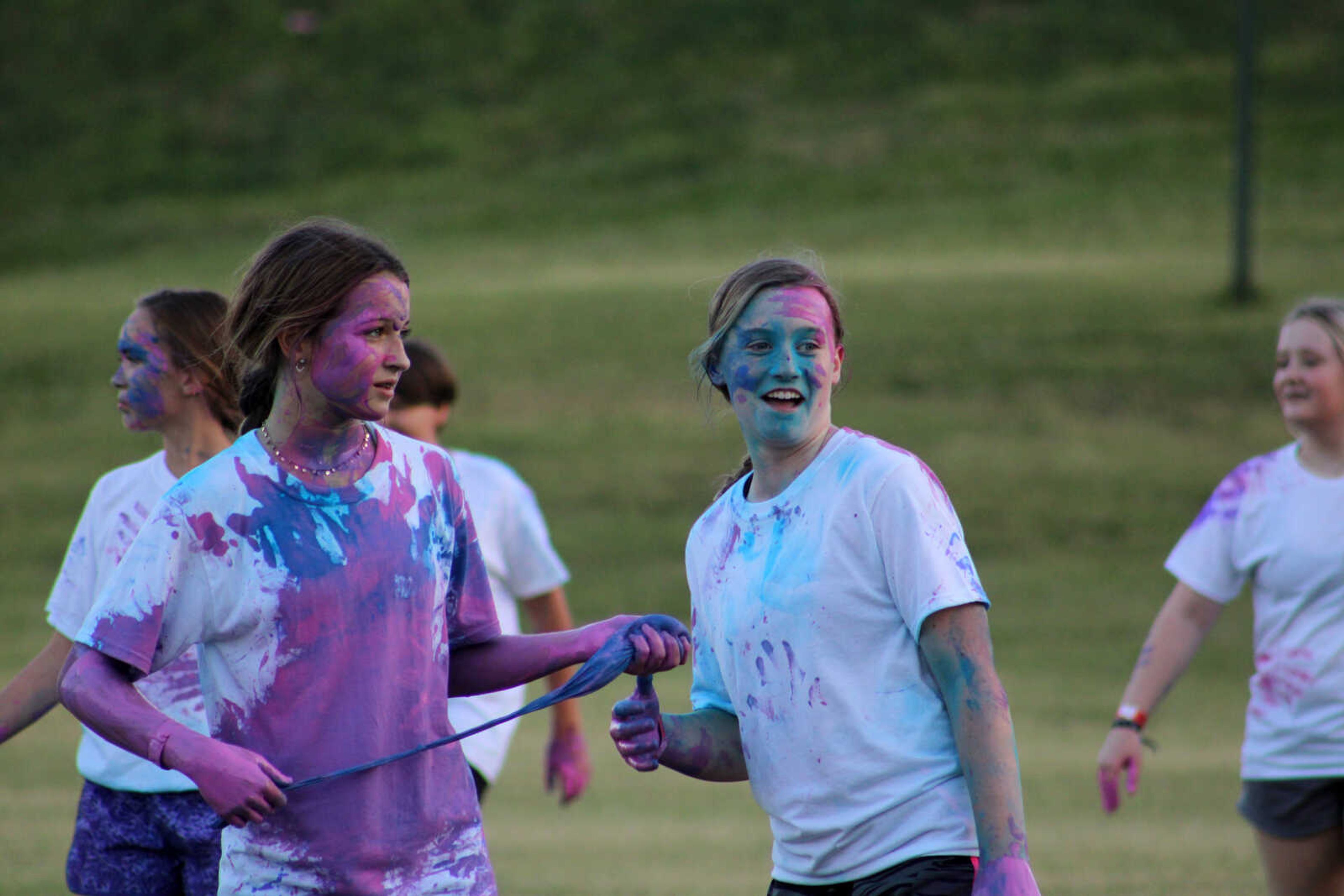 Students watch other players get covered in paint during Paint Wars at Lynwood Baptist Church in Cape Girardeau Wednesday, Sept. 15, 2021.