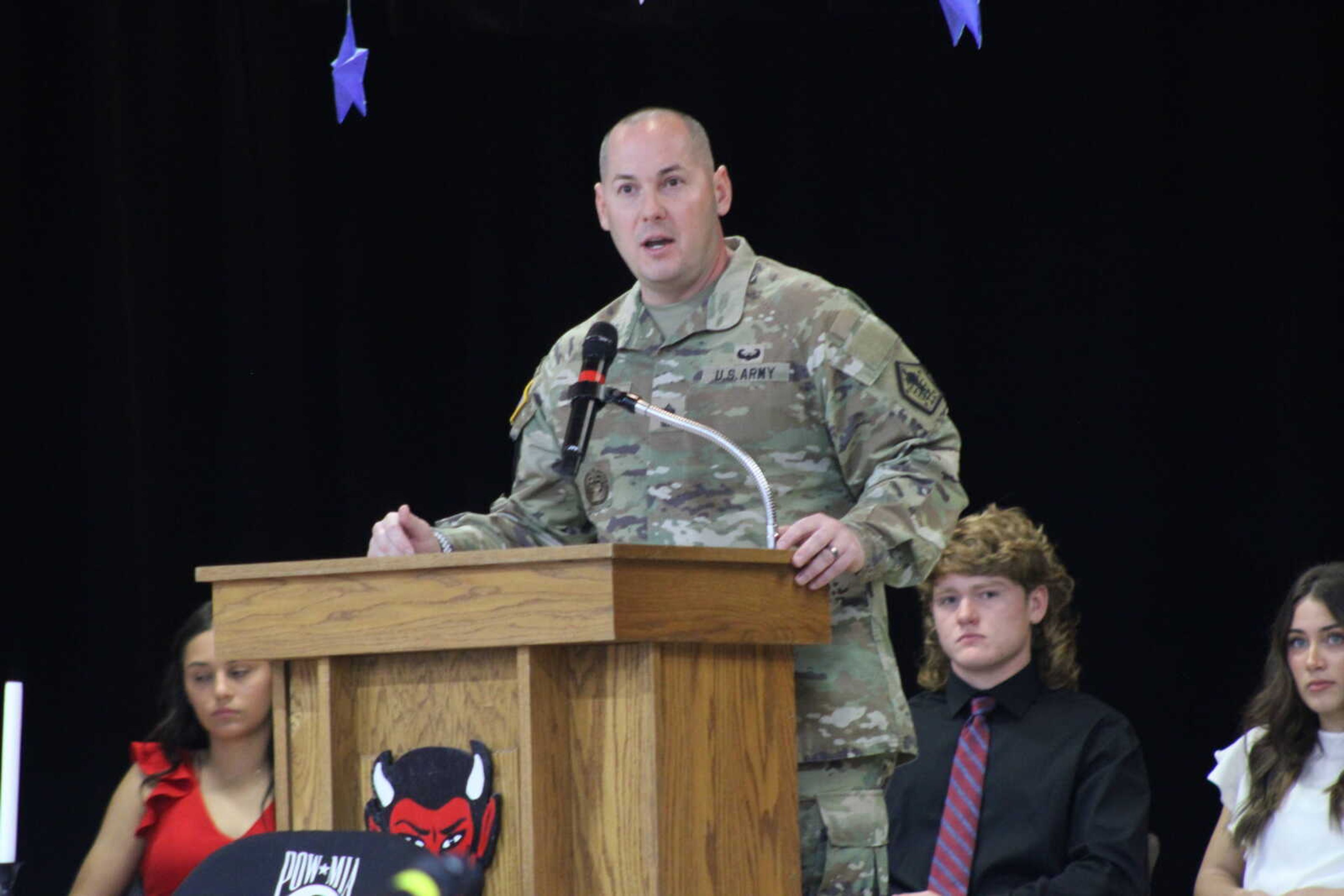 United States Army Sergeant Major David Little speaks to the audience about his service.