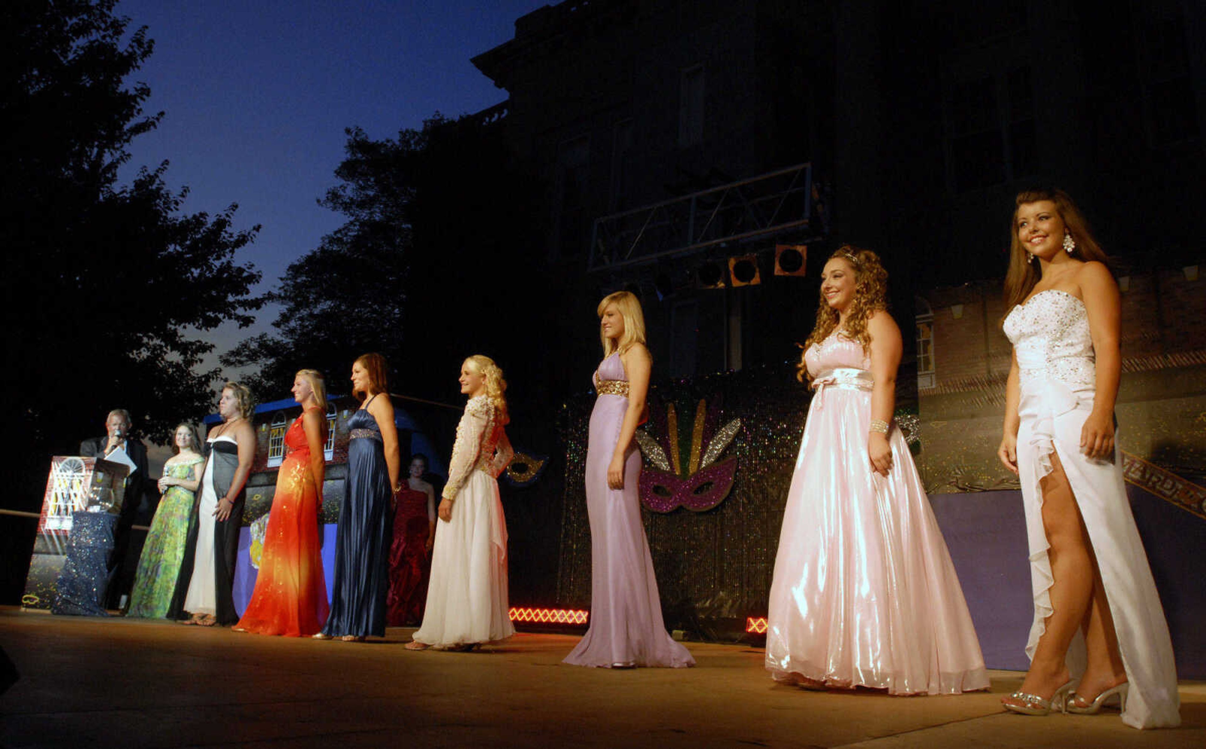 KRISTIN EBERTS ~ keberts@semissourian.com

Competitors in the Miss Homecomers Queen Pageant line up for the evening gown portion of the competition at the 102nd Annual Homecomers Celebration in downtown Jackson on Tuesday, July 27, 2010. Tuesday marked the opening day of the celebration, which lasts through Saturday.