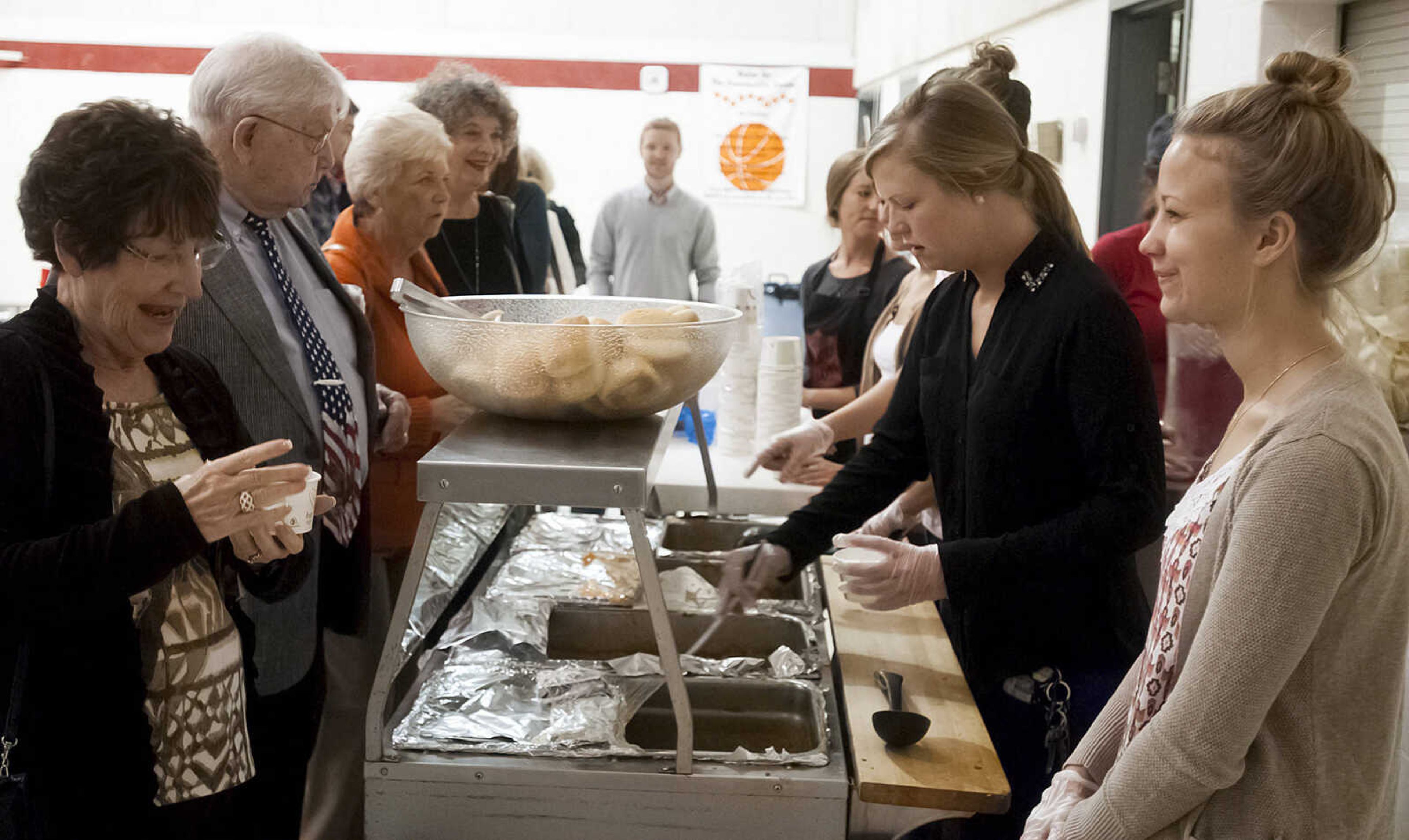 People make their way down the soup line at the 8th annual Empty Bowls banquet, Sunday, Nov. 3, at the Salvation Army, 701 Good Hope St, in Cape Girardeau. Attendees received a hand made bowl and a simple soup lunch, which included soup, bread, drink and desert, in exchange for $12. Proceeds from the event go towards the Salvation Army's meals with friends program.