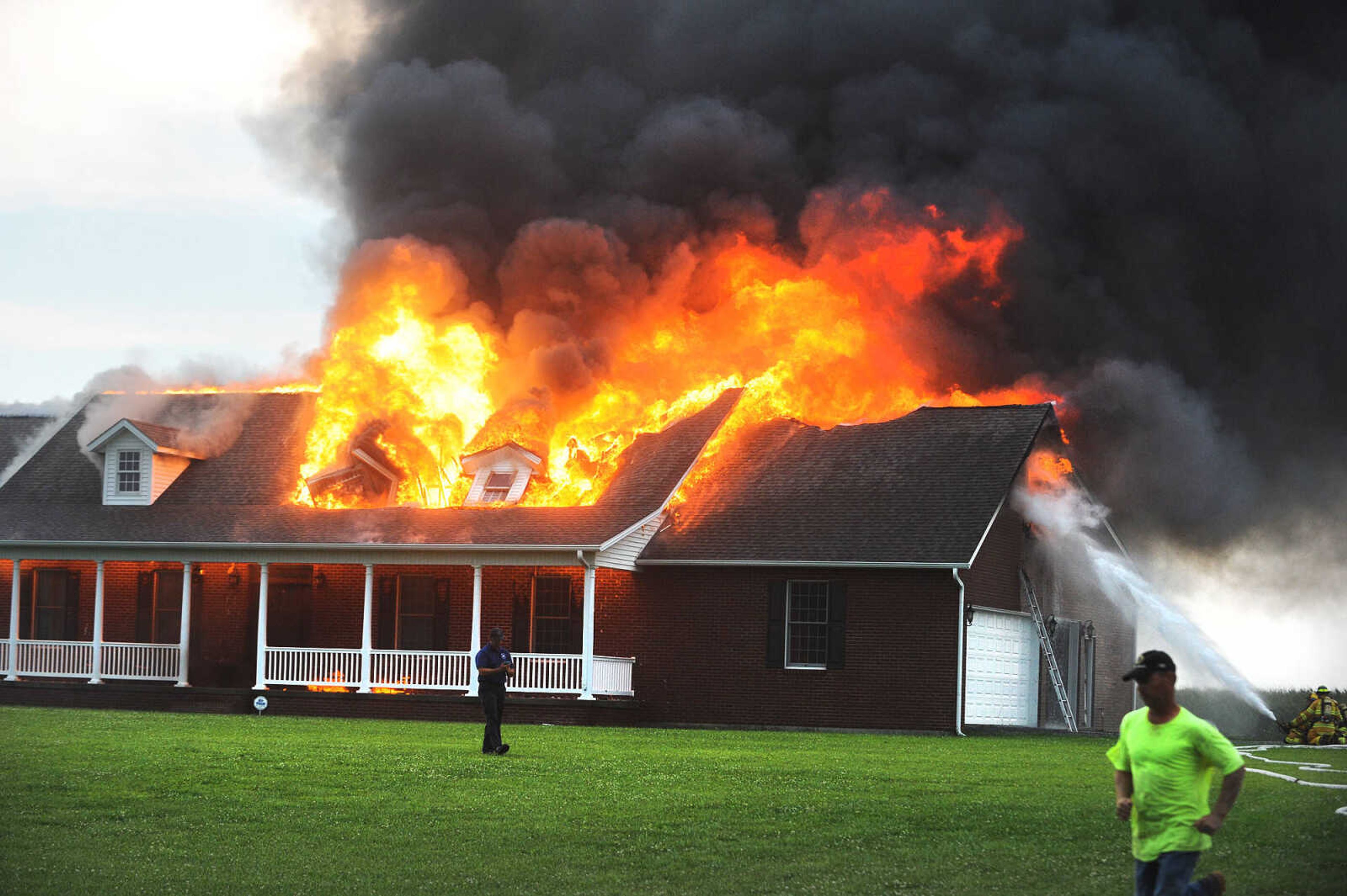 LAURA SIMON ~ lsimon@semissourian.com

Firefighters from Delta, Scott City, Chaffee and New Hamburg/Benton/Commerce battle a house fire off County Road 204 in Scott County Wednesday afternoon, July 23, 2014.