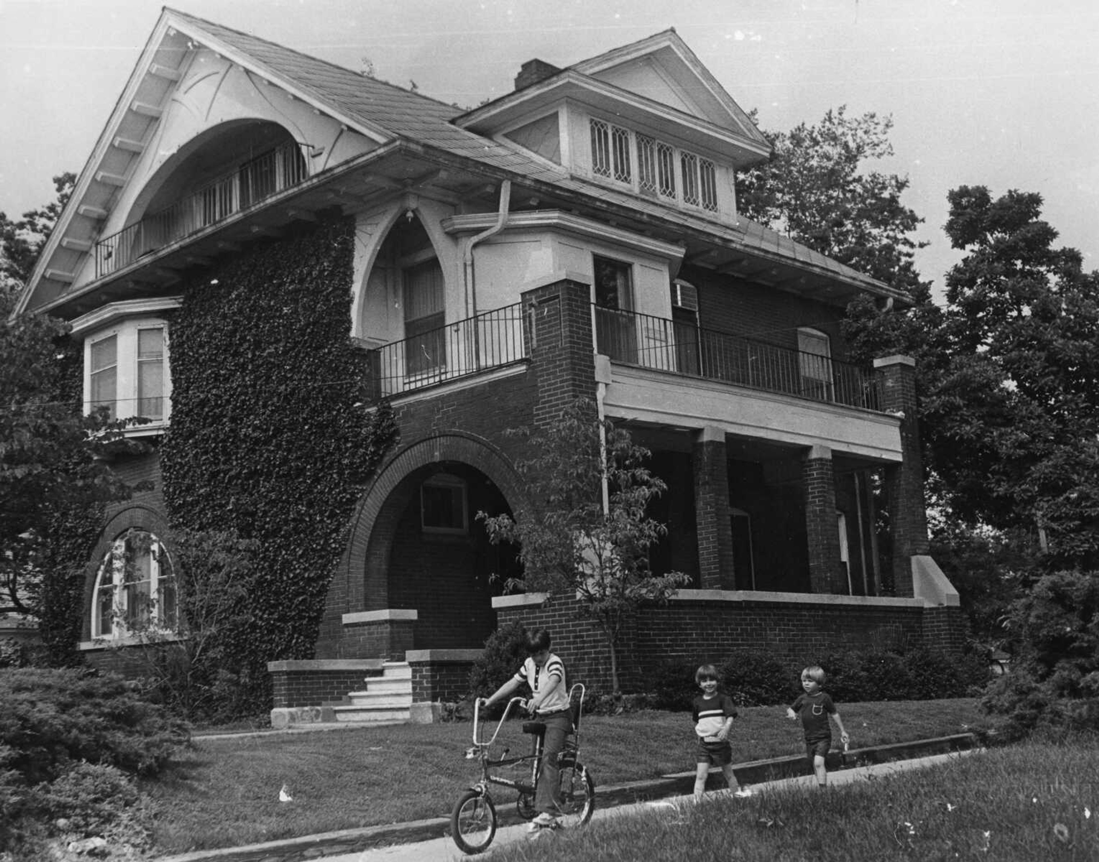 From left to right, brothers Wynn, Jon and Rex Rust walk alongside their childhood home at 700 N. Pacific in Cape Girardeau, Mo., circa 1973.