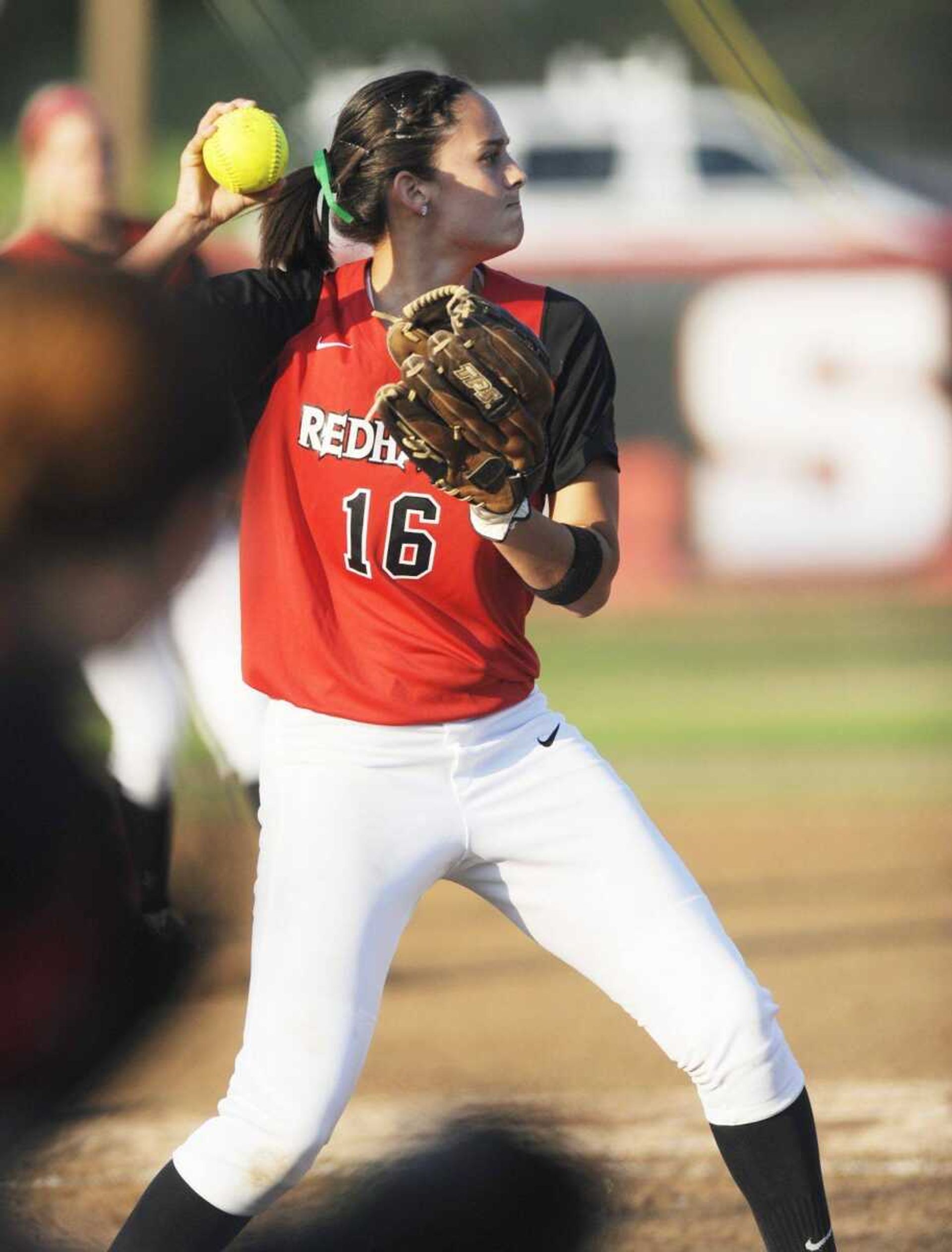 Southeast Missouri State pitcher Alora Marble throws out a batter at first base.