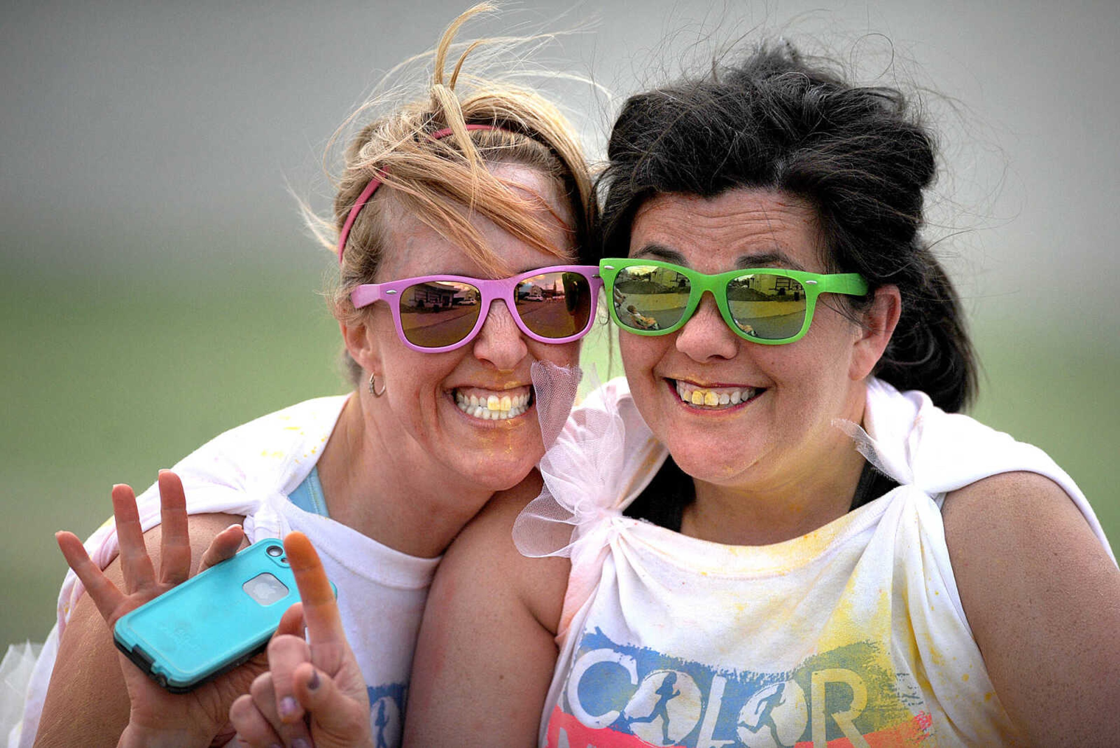 LAURA SIMON ~ lsimon@semissourian.com

Participants in the Color Me Cape 5K are sprayed with yellow powder at the second color station on Frederick Street, Saturday, April 12, 2014, in Cape Girardeau.