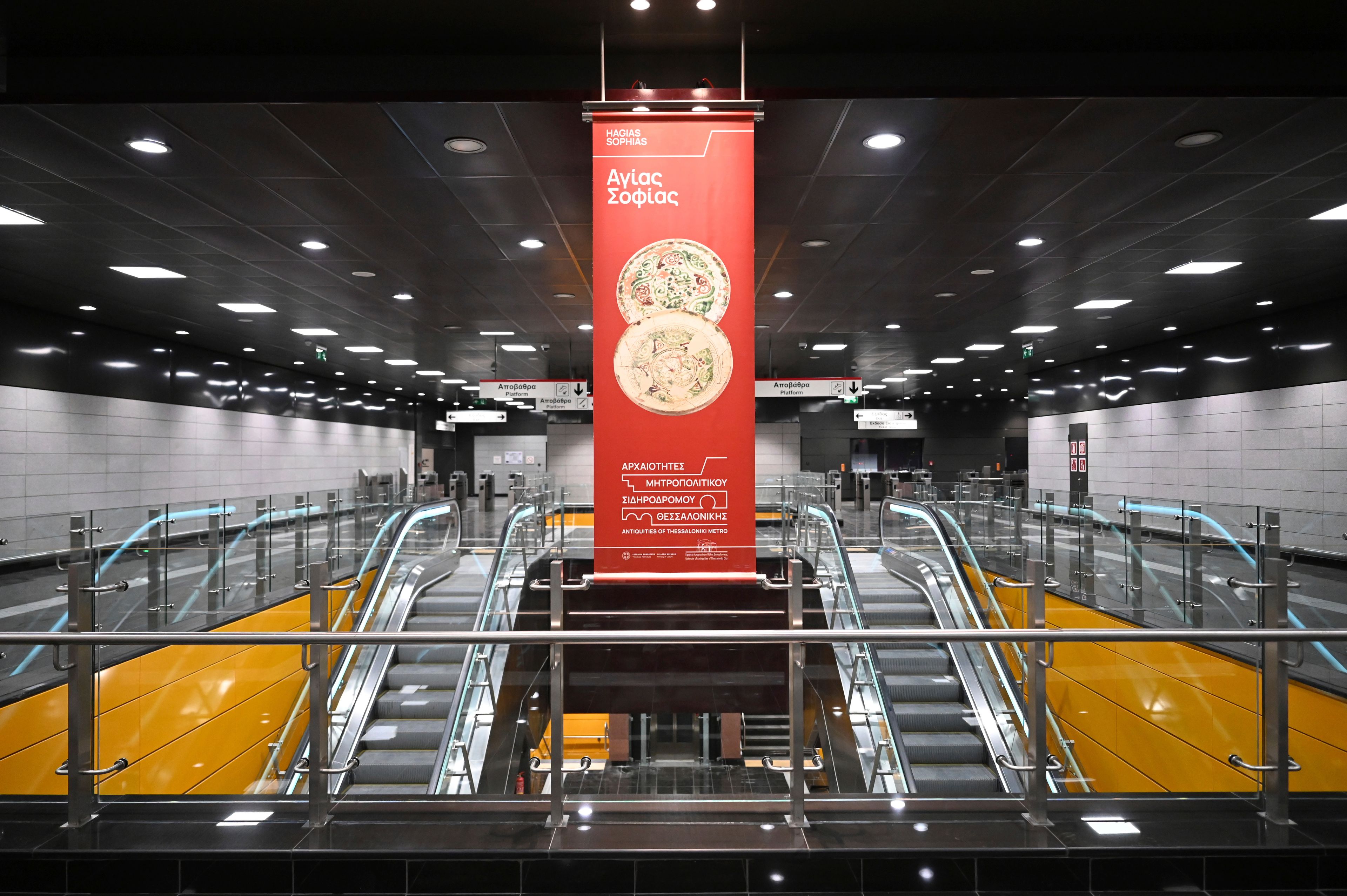 A banner referring to the ancient antiquities on display at the newly built Agias Sofias metro station ahead of its Nov. 30 official opening, in Thessaloniki, northern Greece, Friday, Nov. 22, 2024 – part of the city's long-delayed subway system showcasing archaeological finds from decades of construction. (AP Photo/Giannis Papanikos)