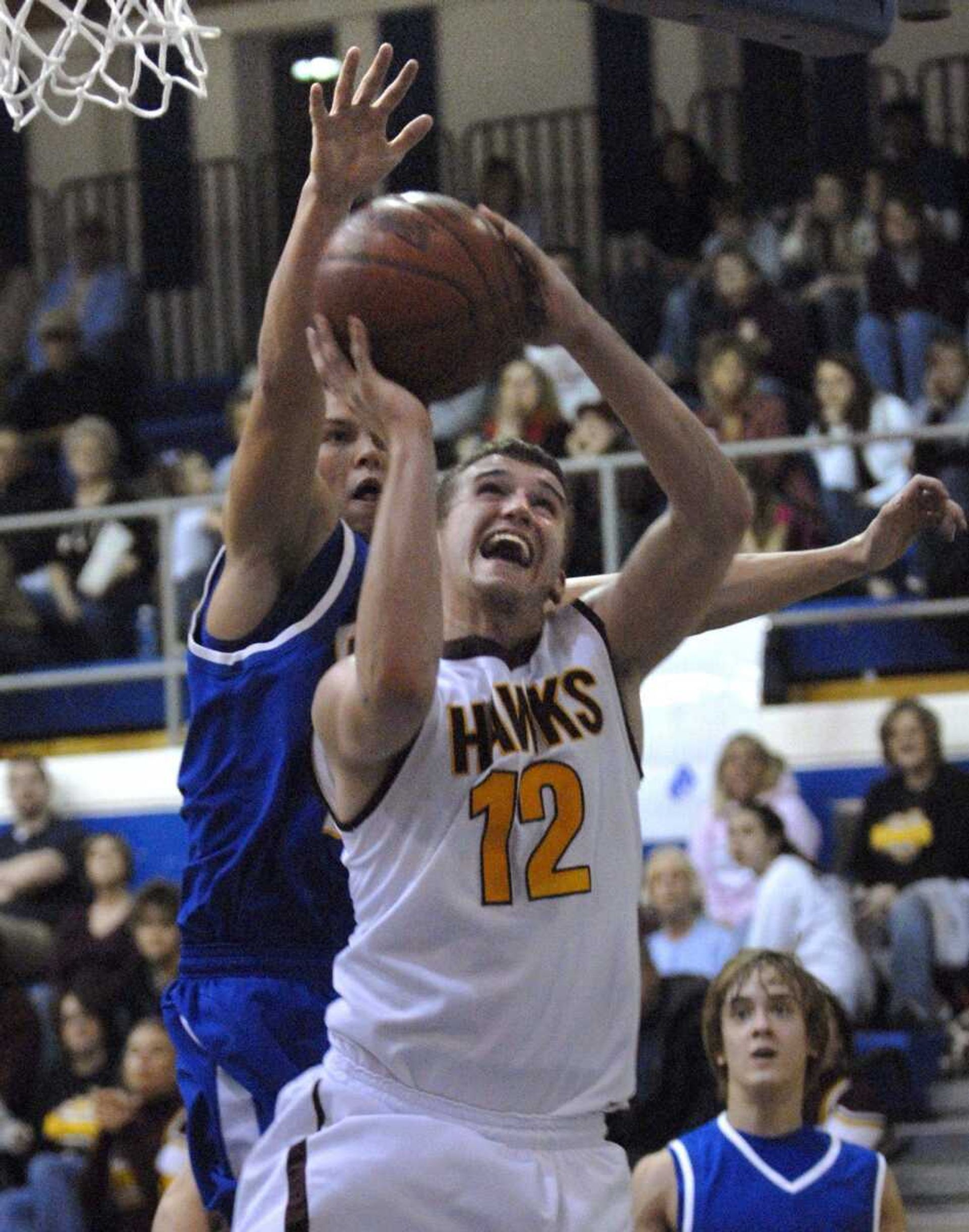 FRED LYNCH ~ flynch@semissourian.com
Kelly's Josh DeBrock takes a shot as Scott City's Shae Simmons defends during the fourth quarter of their first-round Class 3 District 1 game Monday at Charleston.